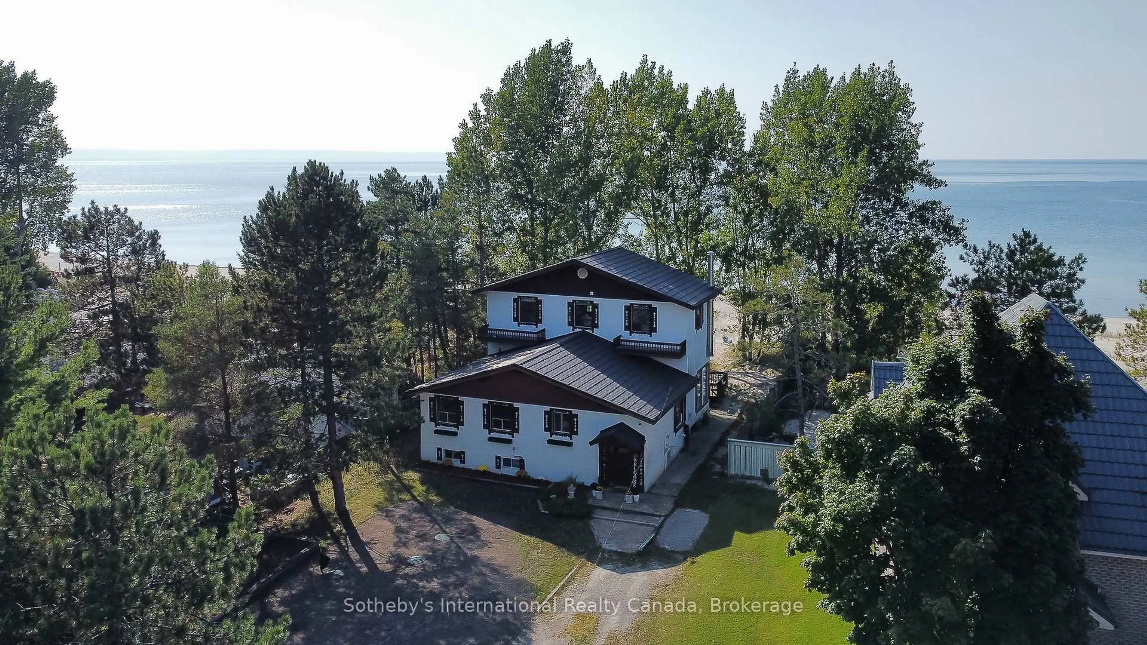 A pic from outside/outdoor area/front of a property/back of a property/a pic from drone, water/lake/river/ocean view for 14 JAMES St, Tiny Ontario L0L 2T0