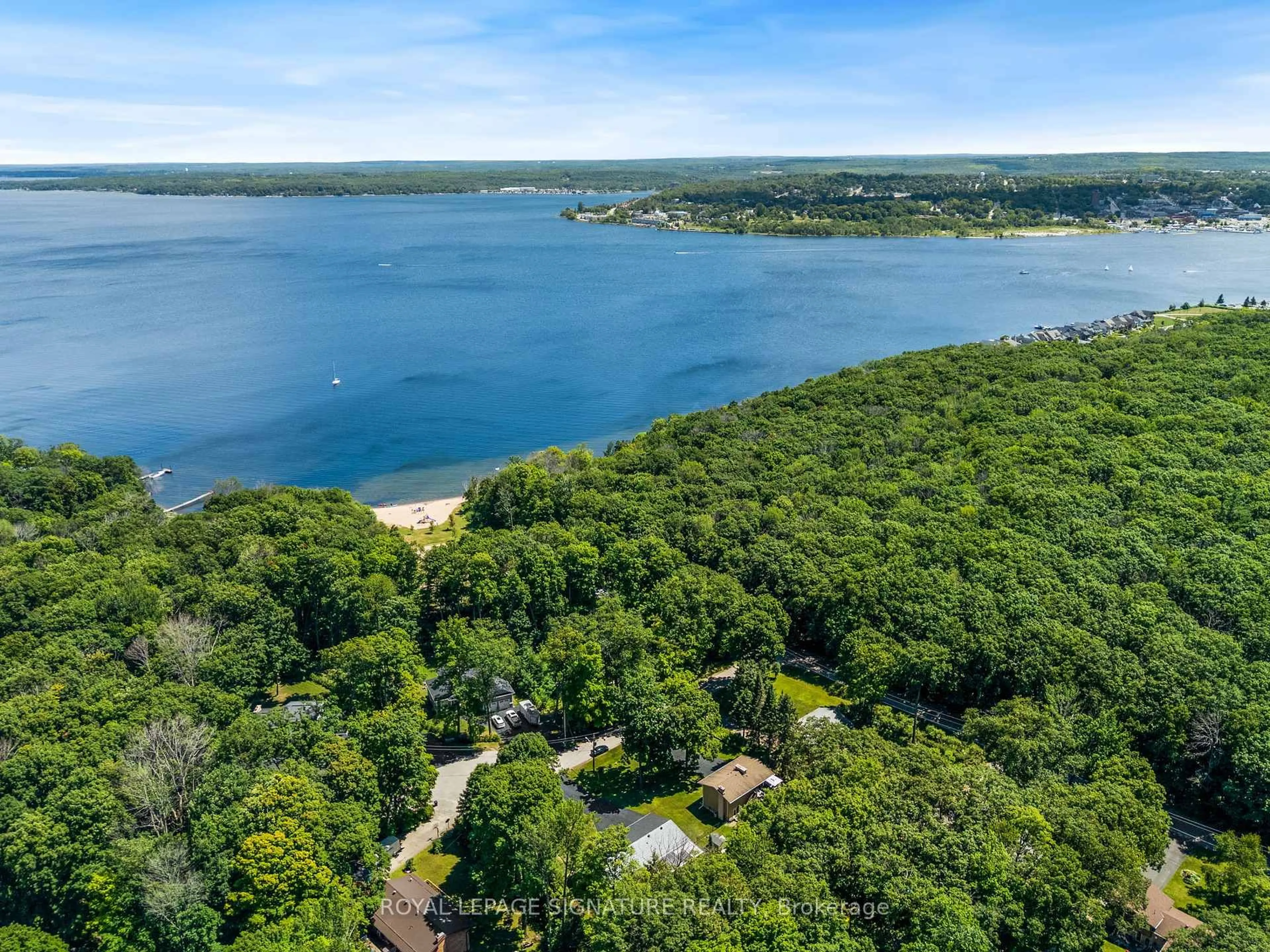 A pic from outside/outdoor area/front of a property/back of a property/a pic from drone, water/lake/river/ocean view for 470 Parkview Crt, Midland Ontario L4R 5G3