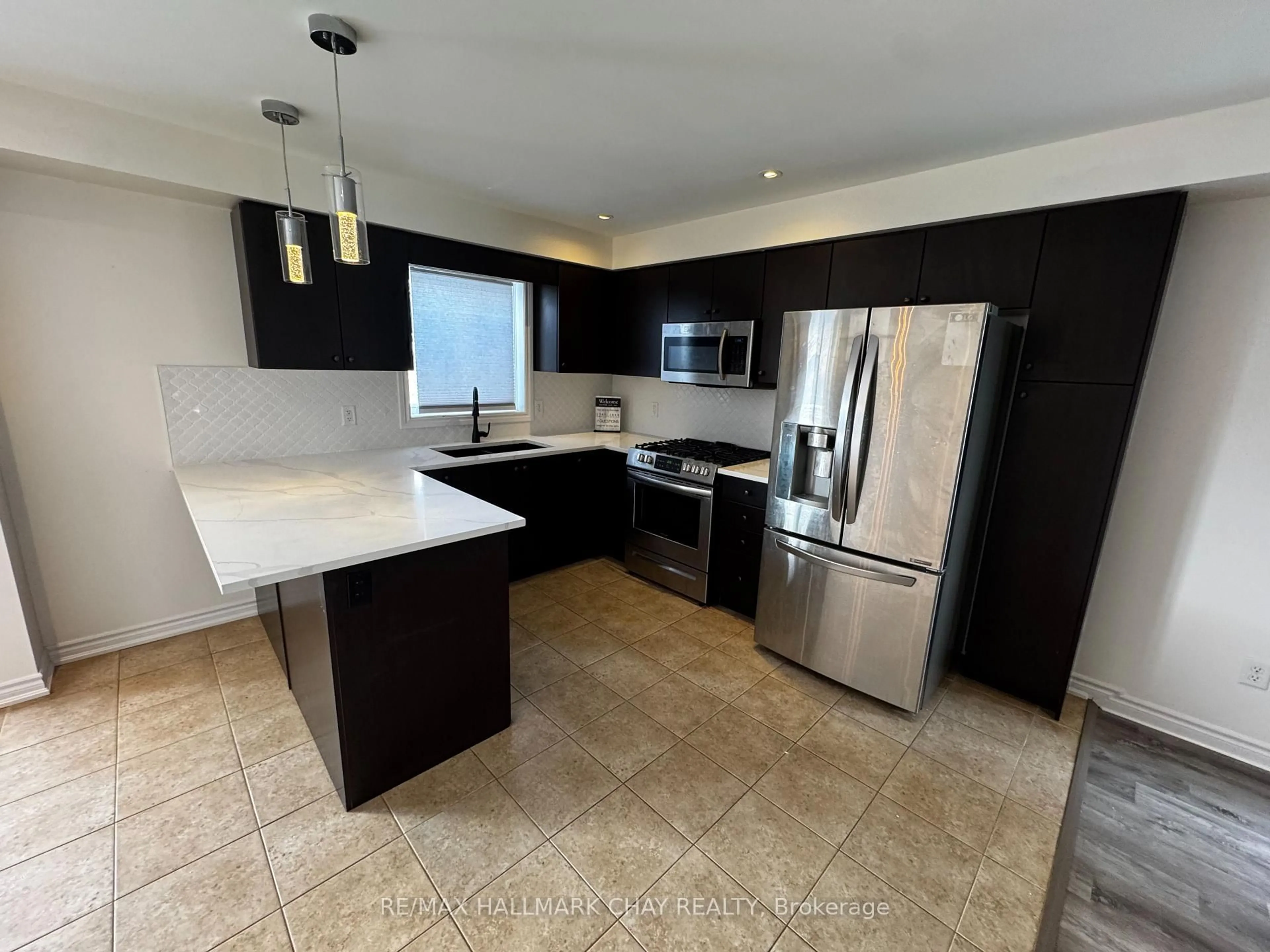 Open concept kitchen, ceramic/tile floor for 77 White Cres, Barrie Ontario L4N 5Z9