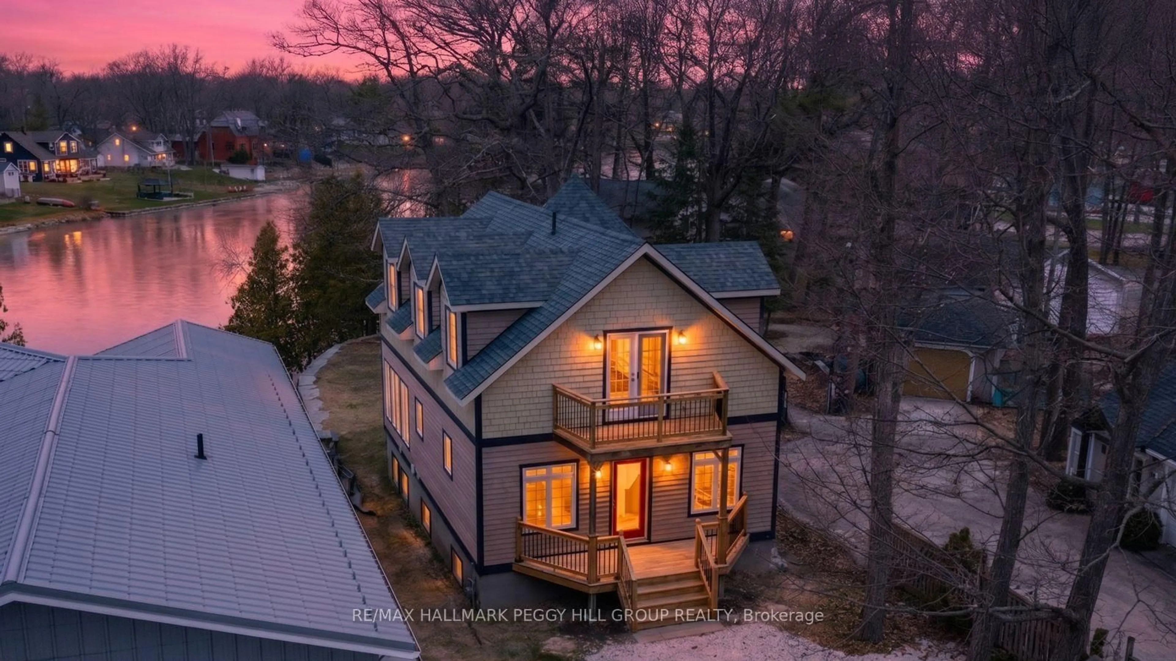 A pic from outside/outdoor area/front of a property/back of a property/a pic from drone, street for 2026 River Rd, Wasaga Beach Ontario L9Z 2W1
