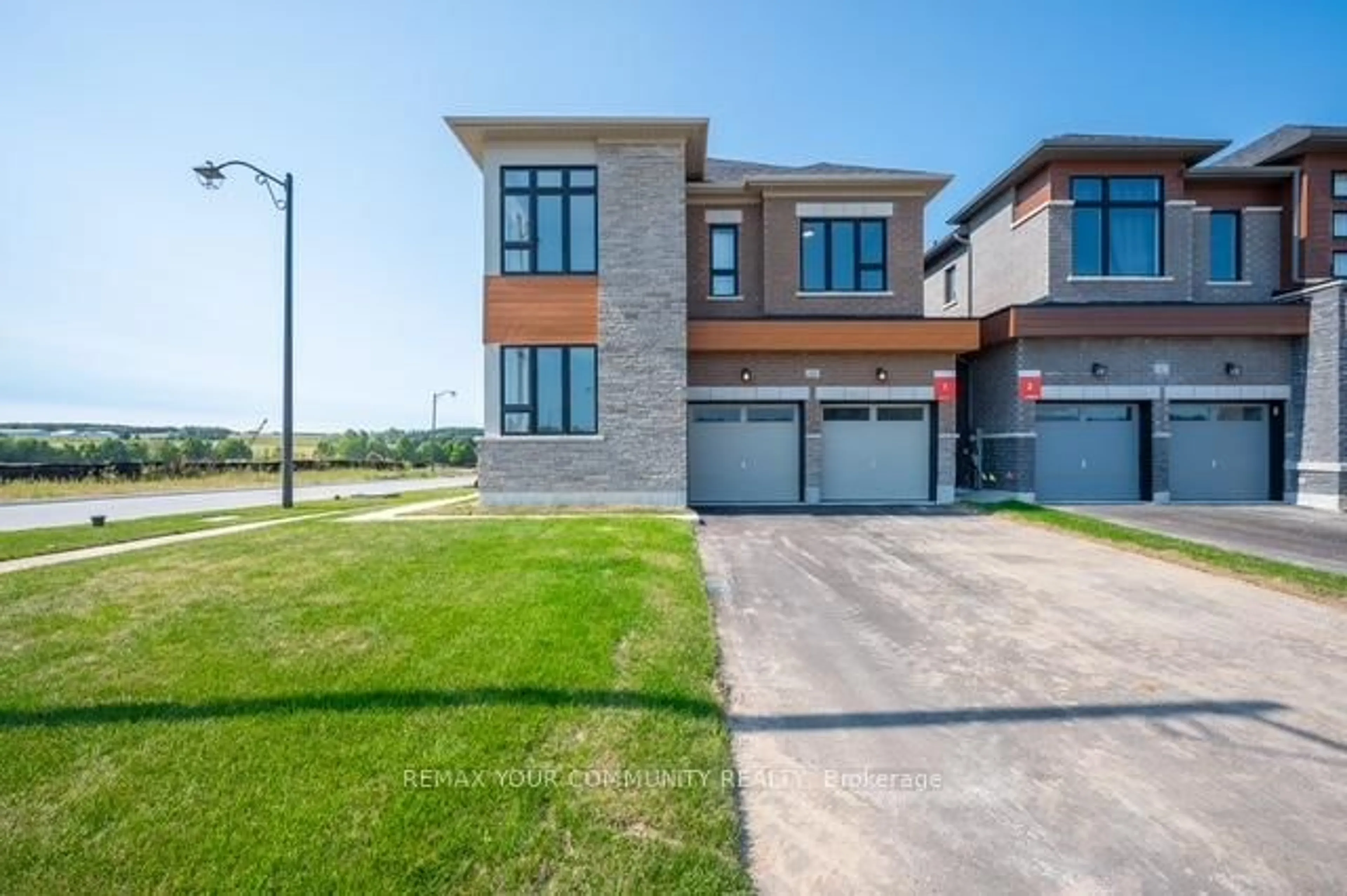 Home with brick exterior material, street for 44 Wild Ginger Lane, Springwater Ontario L9X 2C9