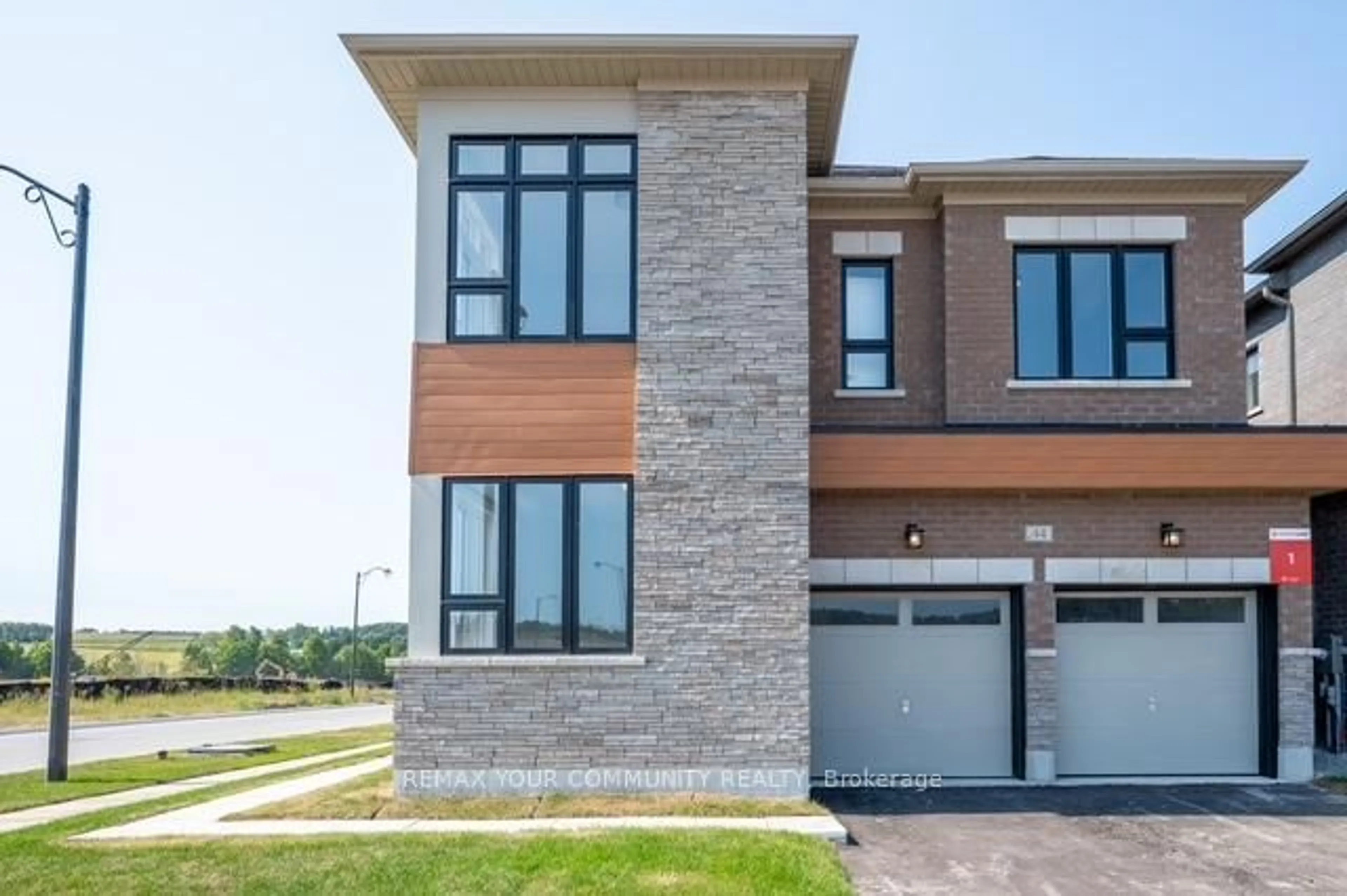 Home with brick exterior material, street for 44 Wild Ginger Lane, Springwater Ontario L9X 2C9
