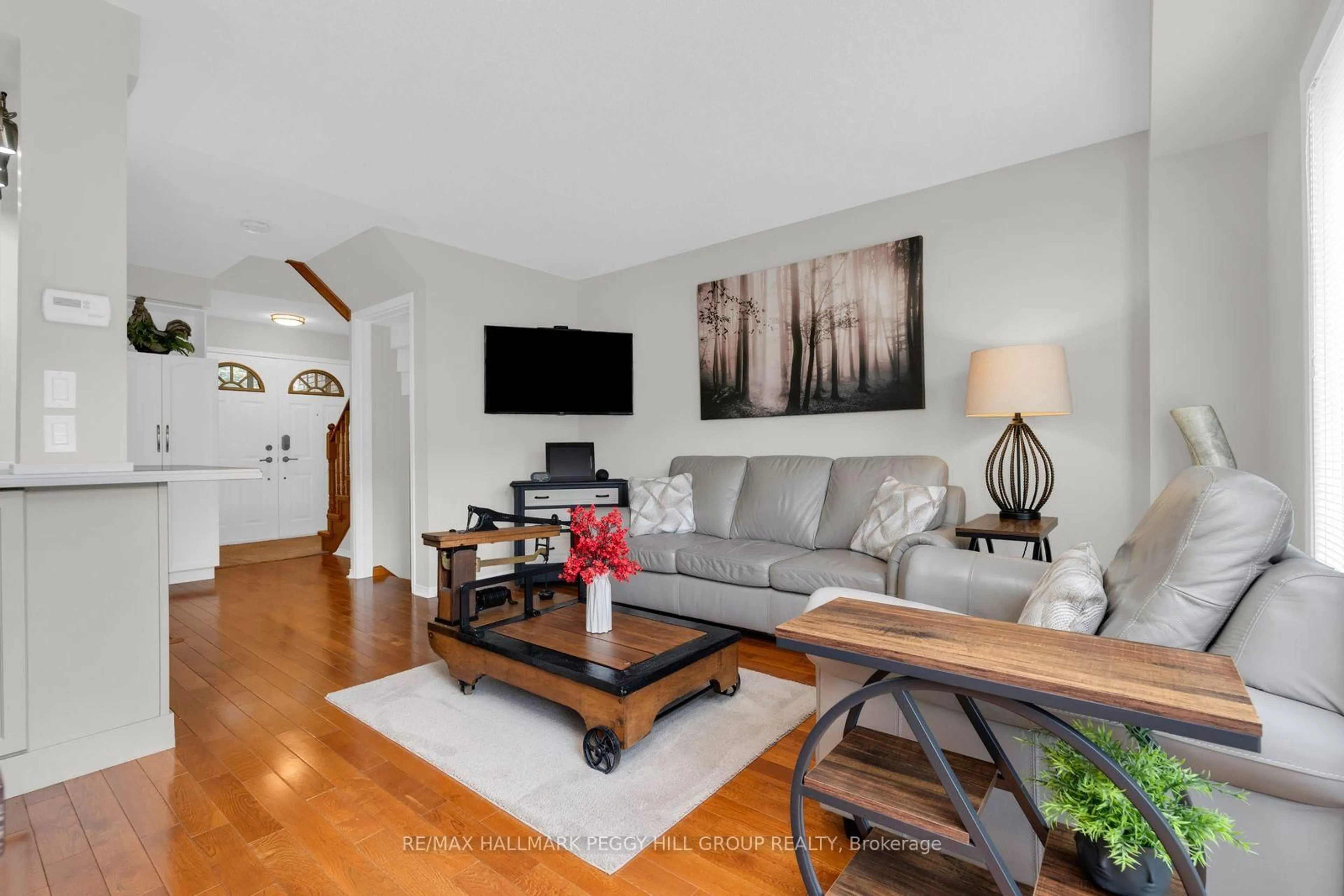 Living room with furniture, wood/laminate floor for 492 Laclie St #15, Orillia Ontario L3V 7V2