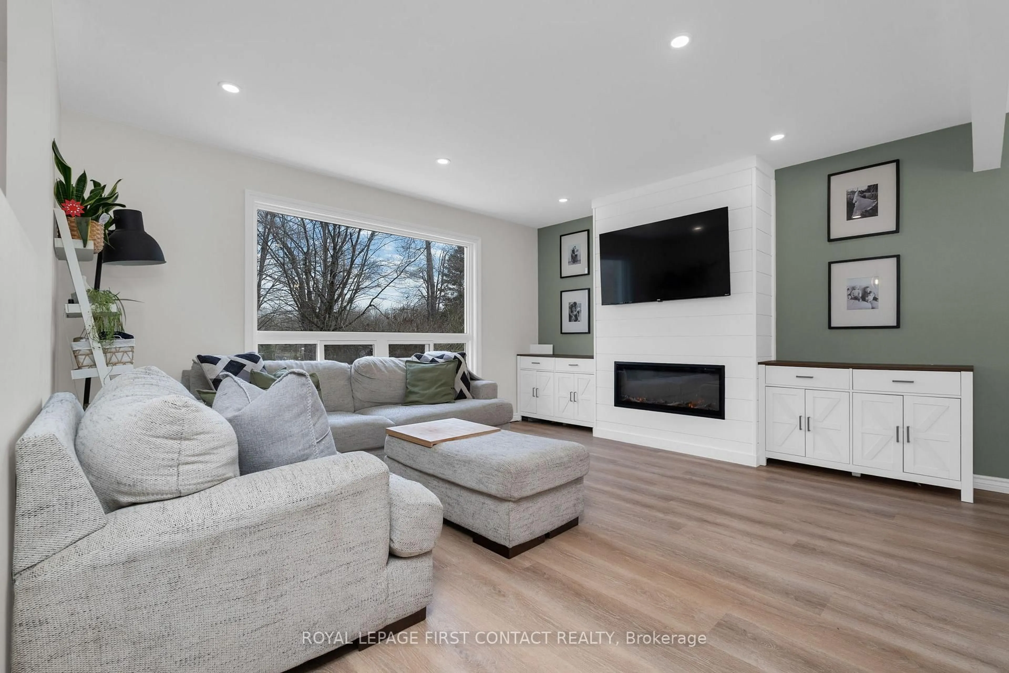 Living room with furniture, wood/laminate floor for 5532 Old Udney Sdrd, Ramara Ontario L3V 0P6