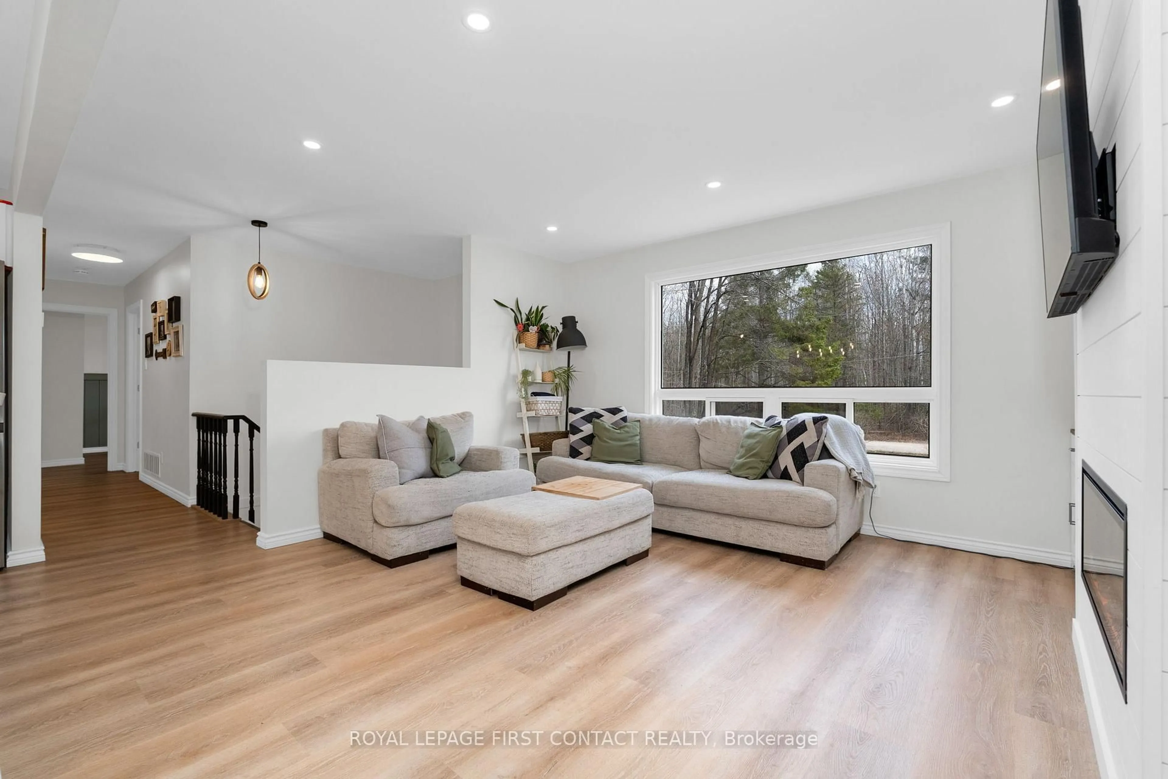 Living room with furniture, wood/laminate floor for 5532 Old Udney Sdrd, Ramara Ontario L3V 0P6