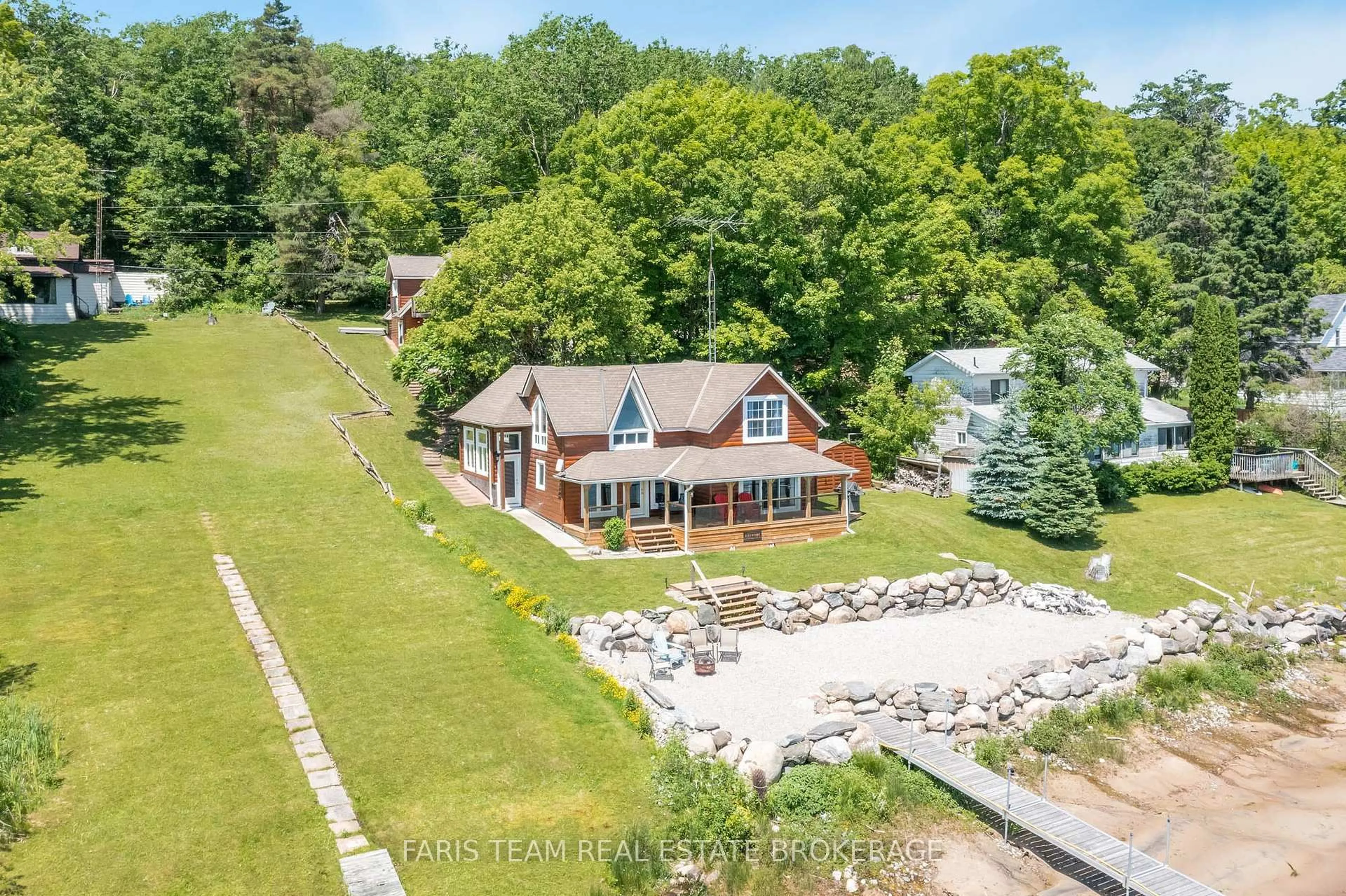A pic from outside/outdoor area/front of a property/back of a property/a pic from drone, water/lake/river/ocean view for 375 Champlain Rd, Penetanguishene Ontario L9M 1S3