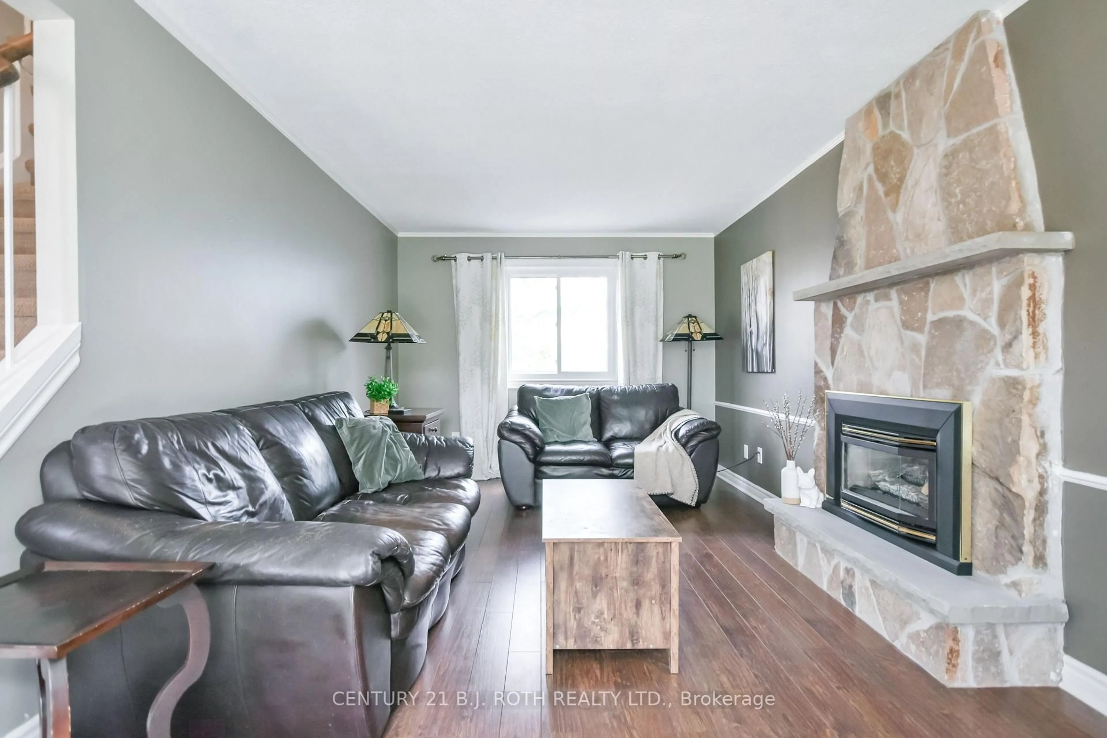 Living room with furniture, wood/laminate floor for 11 Pepler Pl, Barrie Ontario L4N 5E3