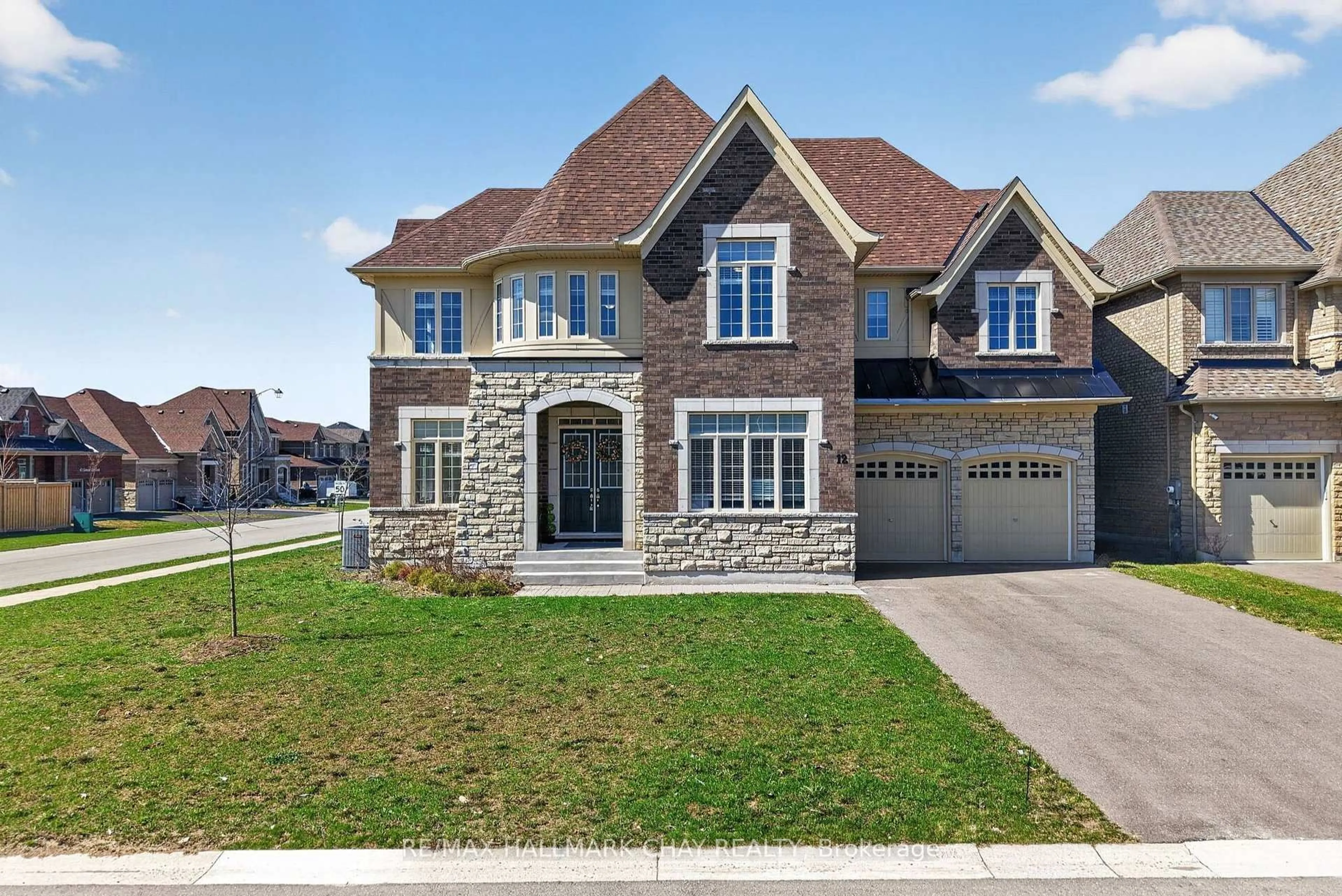 Home with brick exterior material, street for 12 Thompson Way, Springwater Ontario L9X 2A5