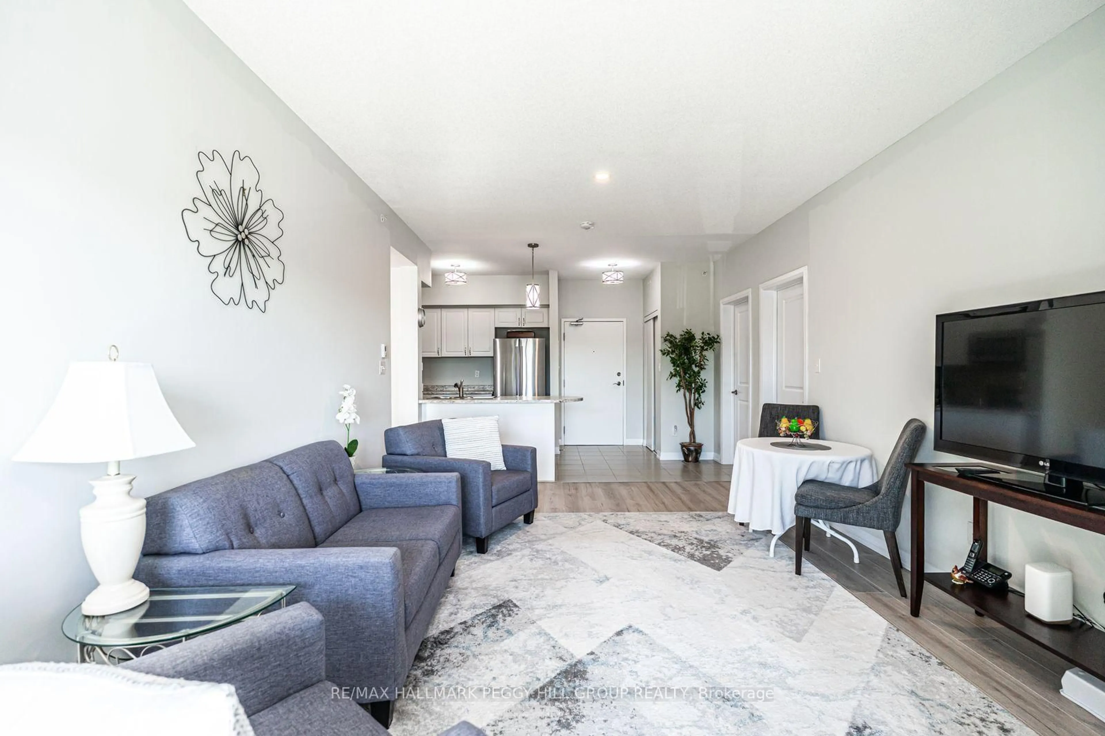 Living room with furniture, unknown for 295 Cundles Rd #404, Barrie Ontario L4M 0K8
