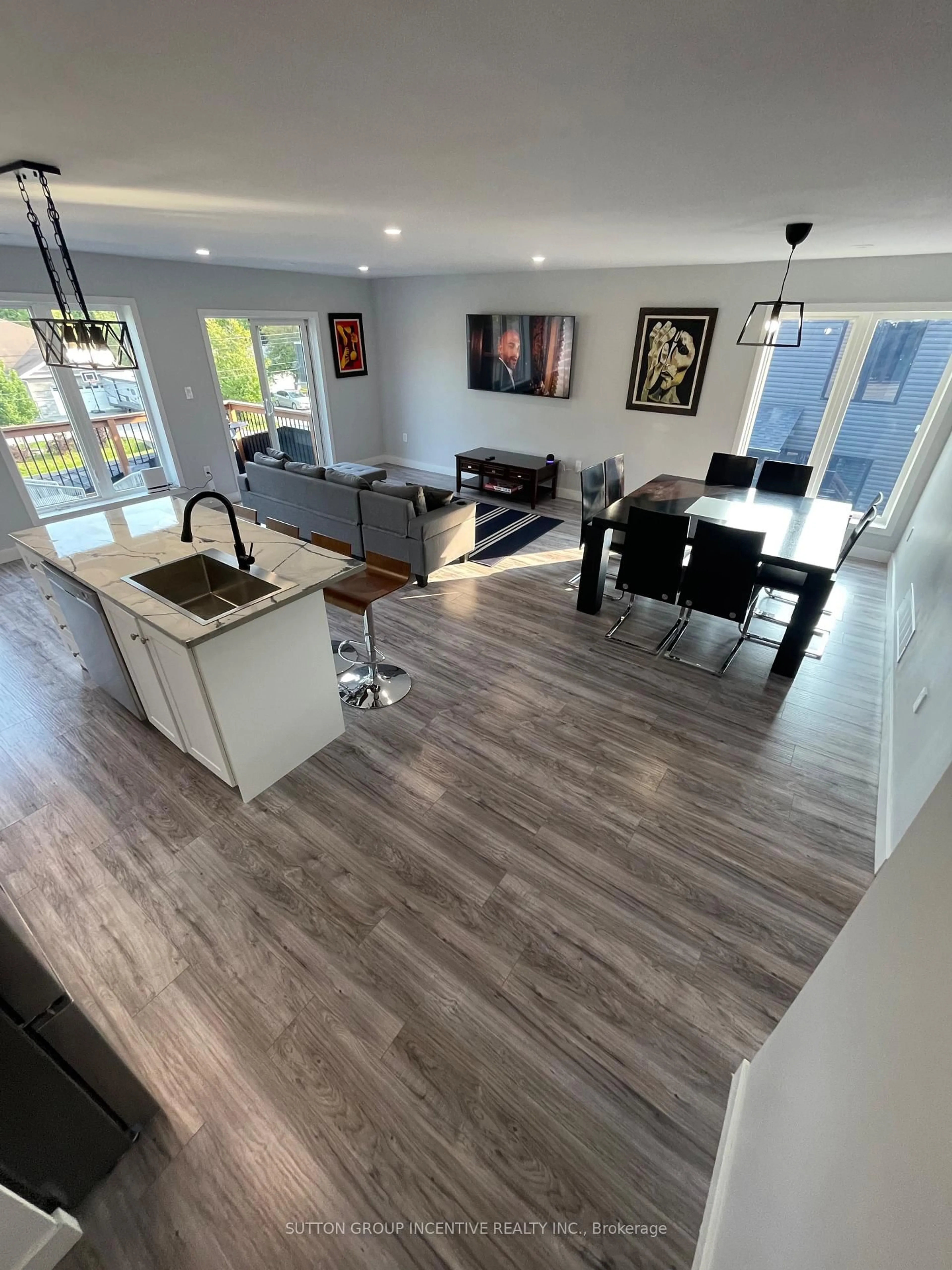 Open concept kitchen, wood/laminate floor for 52 Marilyn Ave, Wasaga Beach Ontario L9Z 2Y1