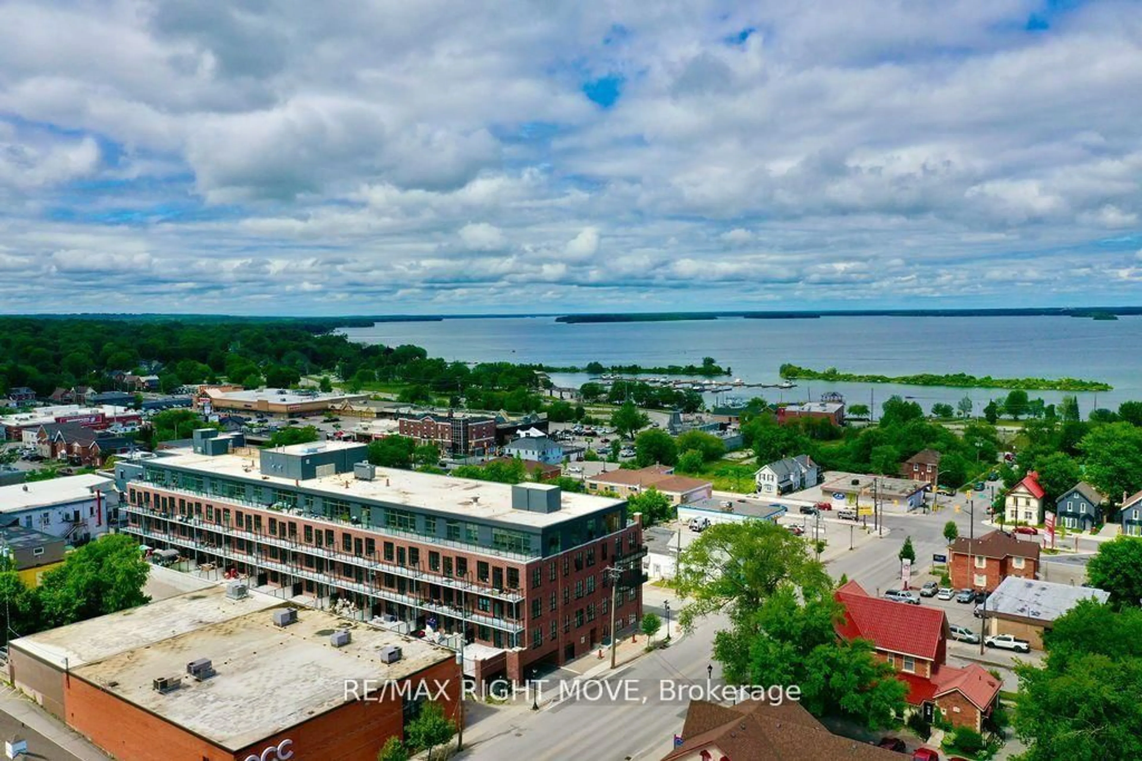 A pic from outside/outdoor area/front of a property/back of a property/a pic from drone, water/lake/river/ocean view for 21 Matchedash St #309, Orillia Ontario L3V 4W4