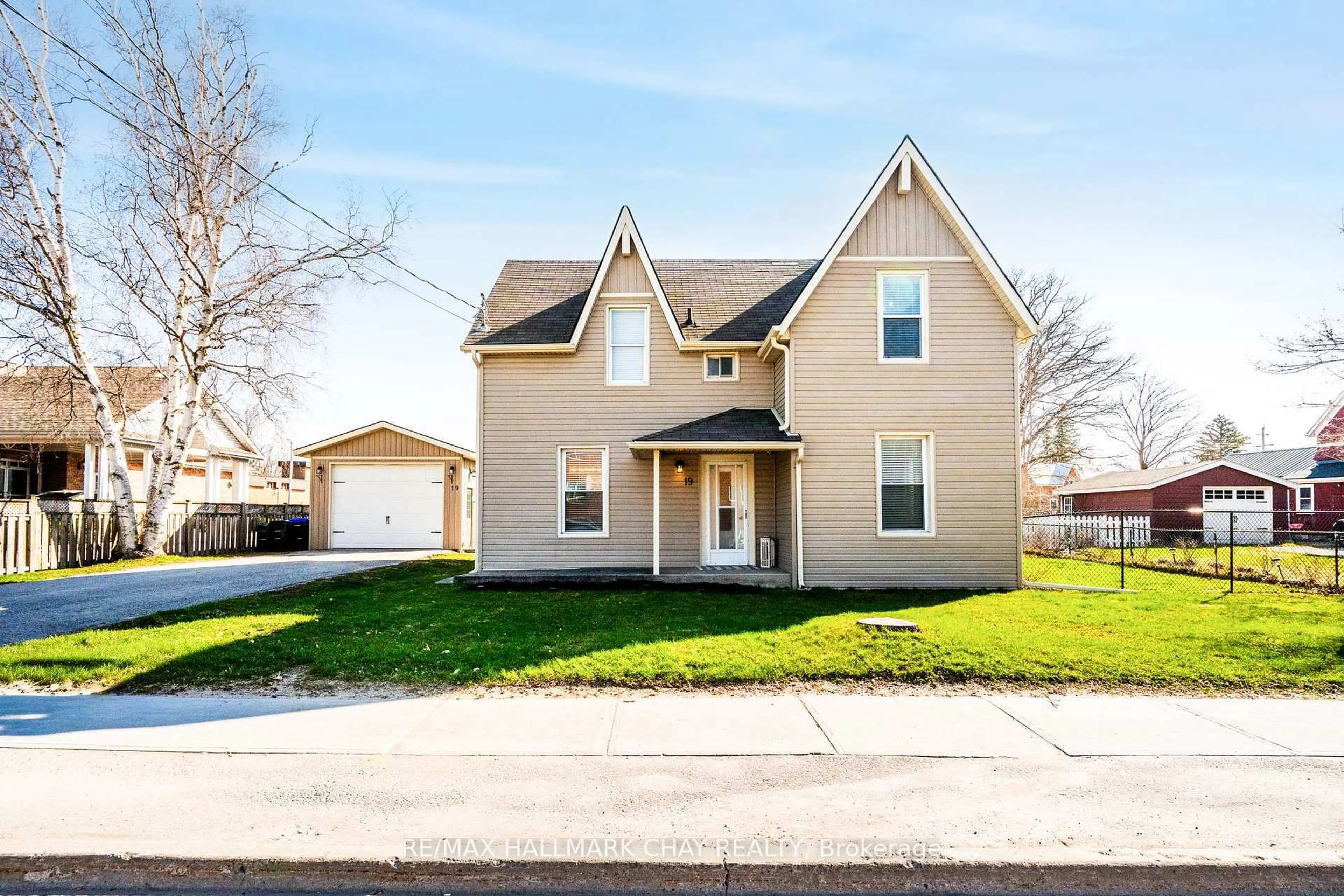 Home with vinyl exterior material, street for 19 Yonge St, Springwater Ontario L0L 1P0