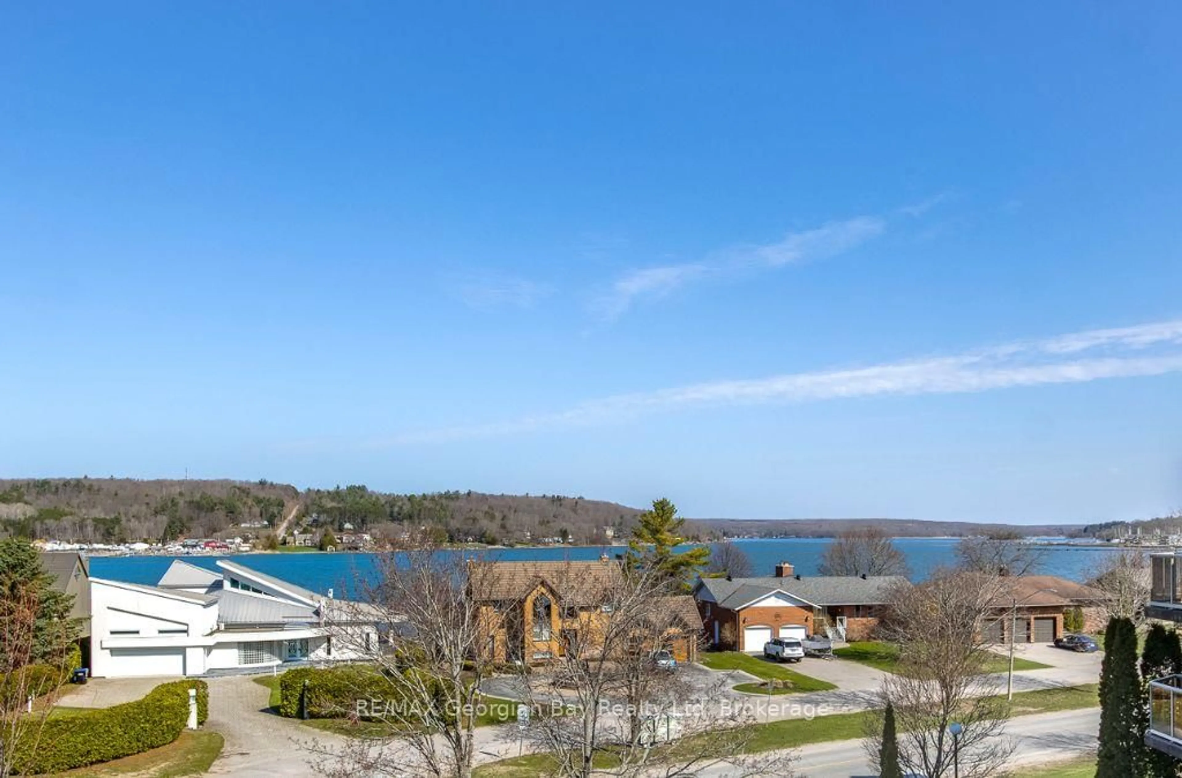 A pic from outside/outdoor area/front of a property/back of a property/a pic from drone, water/lake/river/ocean view for 11 Beck Blvd #404, Penetanguishene Ontario L9M 2G1