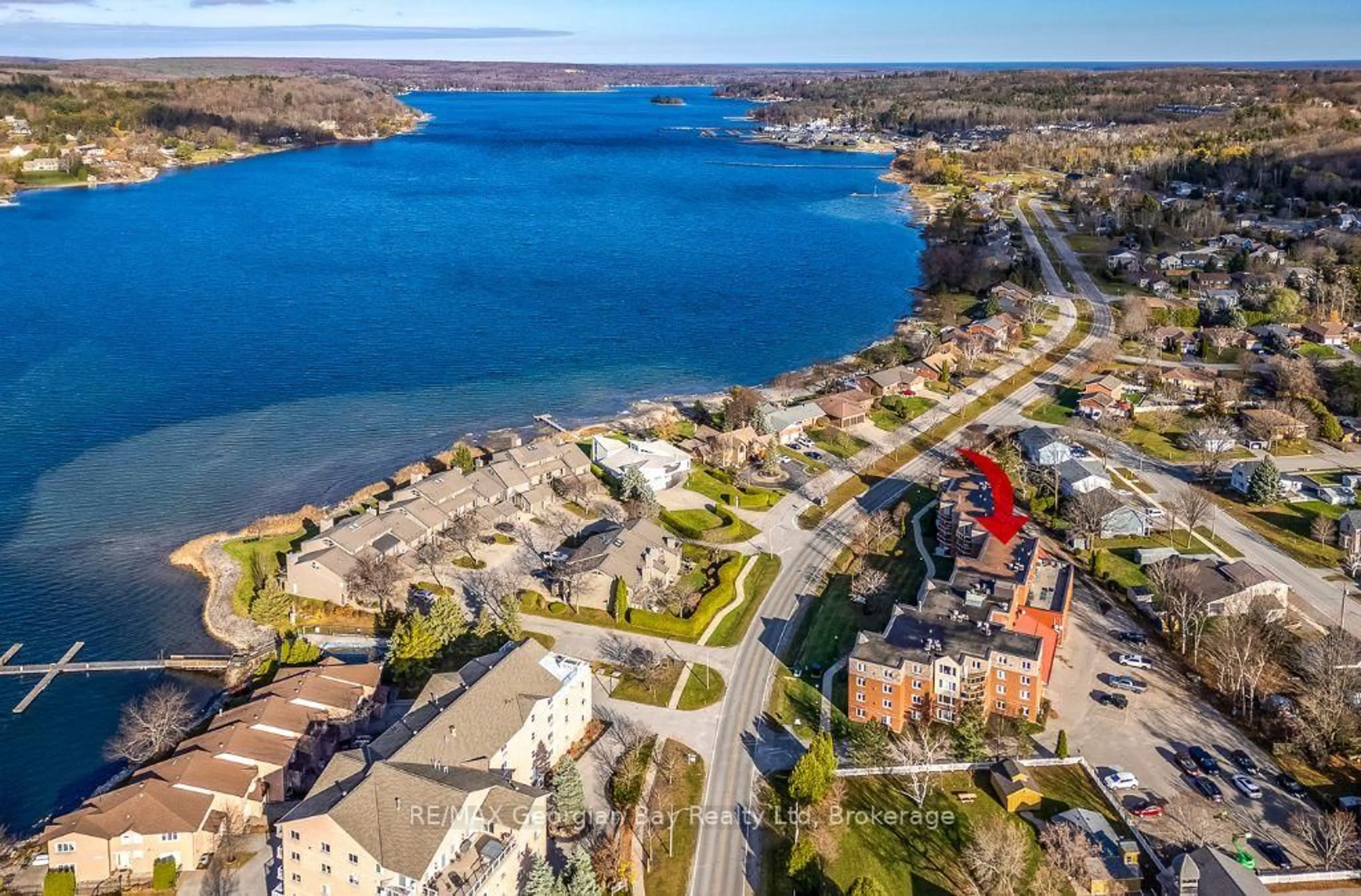 A pic from outside/outdoor area/front of a property/back of a property/a pic from drone, water/lake/river/ocean view for 11 Beck Blvd #404, Penetanguishene Ontario L9M 2G1