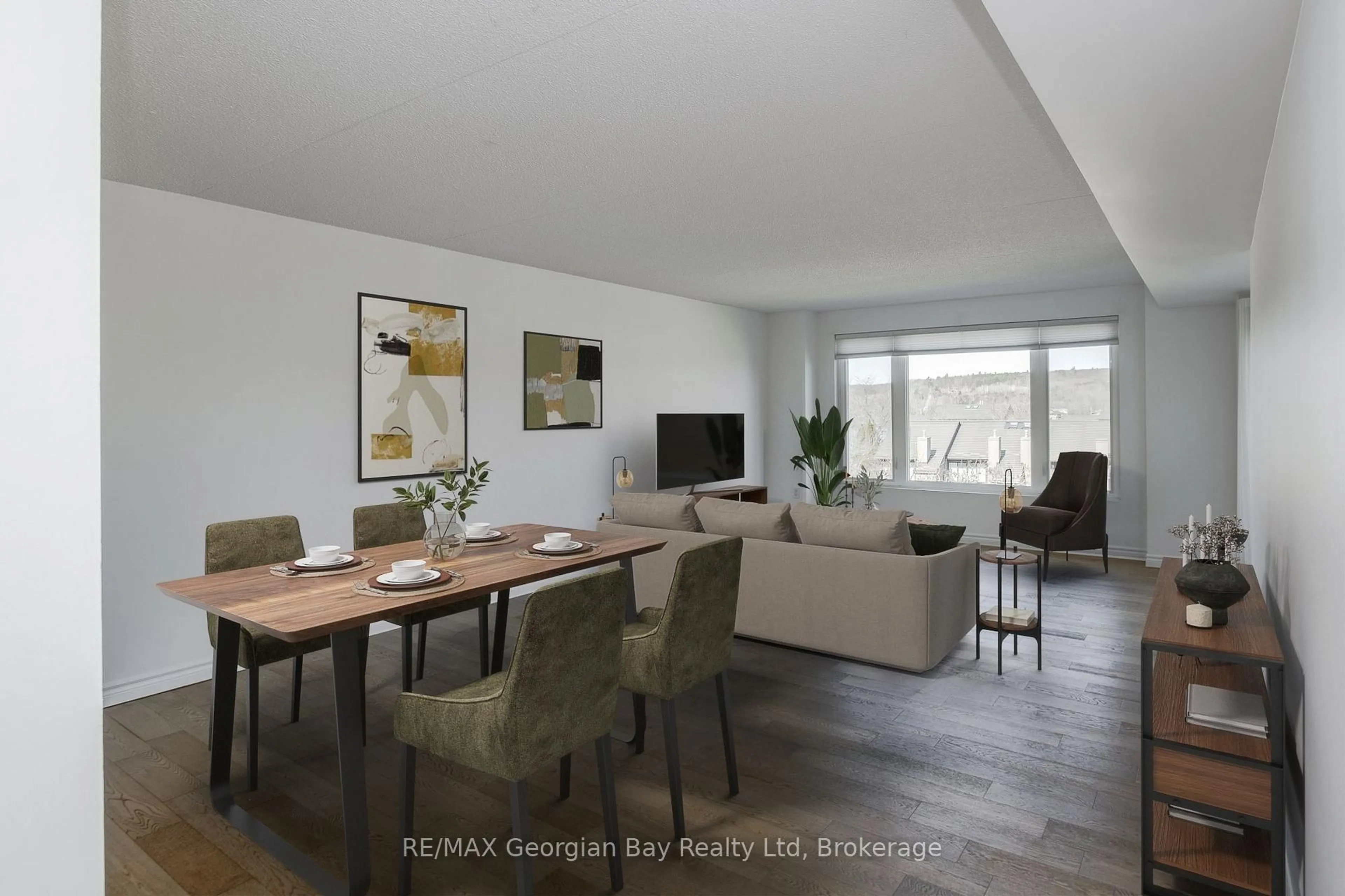 Living room with furniture, wood/laminate floor for 11 Beck Blvd #404, Penetanguishene Ontario L9M 2G1
