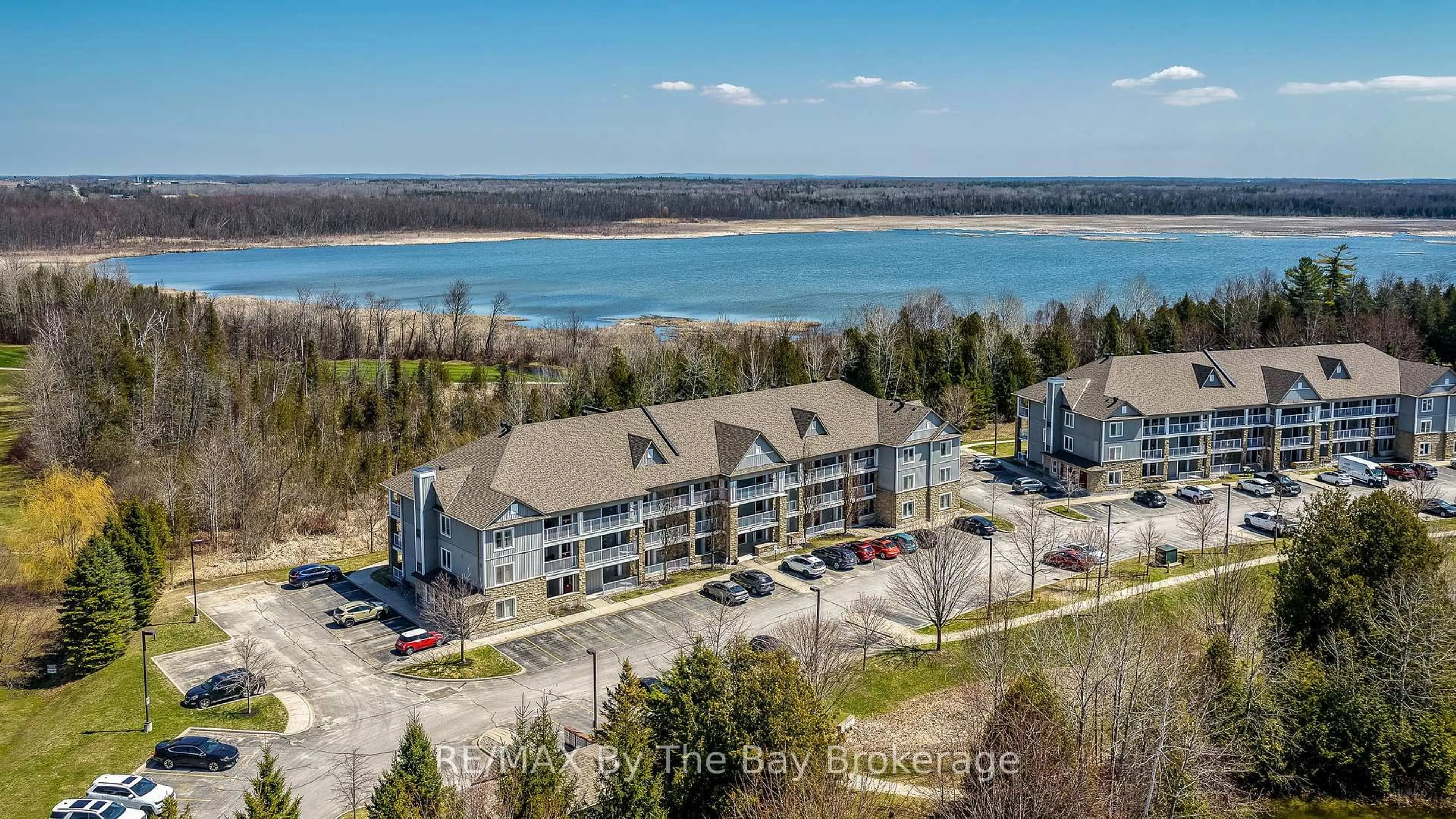 A pic from outside/outdoor area/front of a property/back of a property/a pic from drone, water/lake/river/ocean view for 40 Mulligan Lane #208, Wasaga Beach Ontario L9Z 0C5