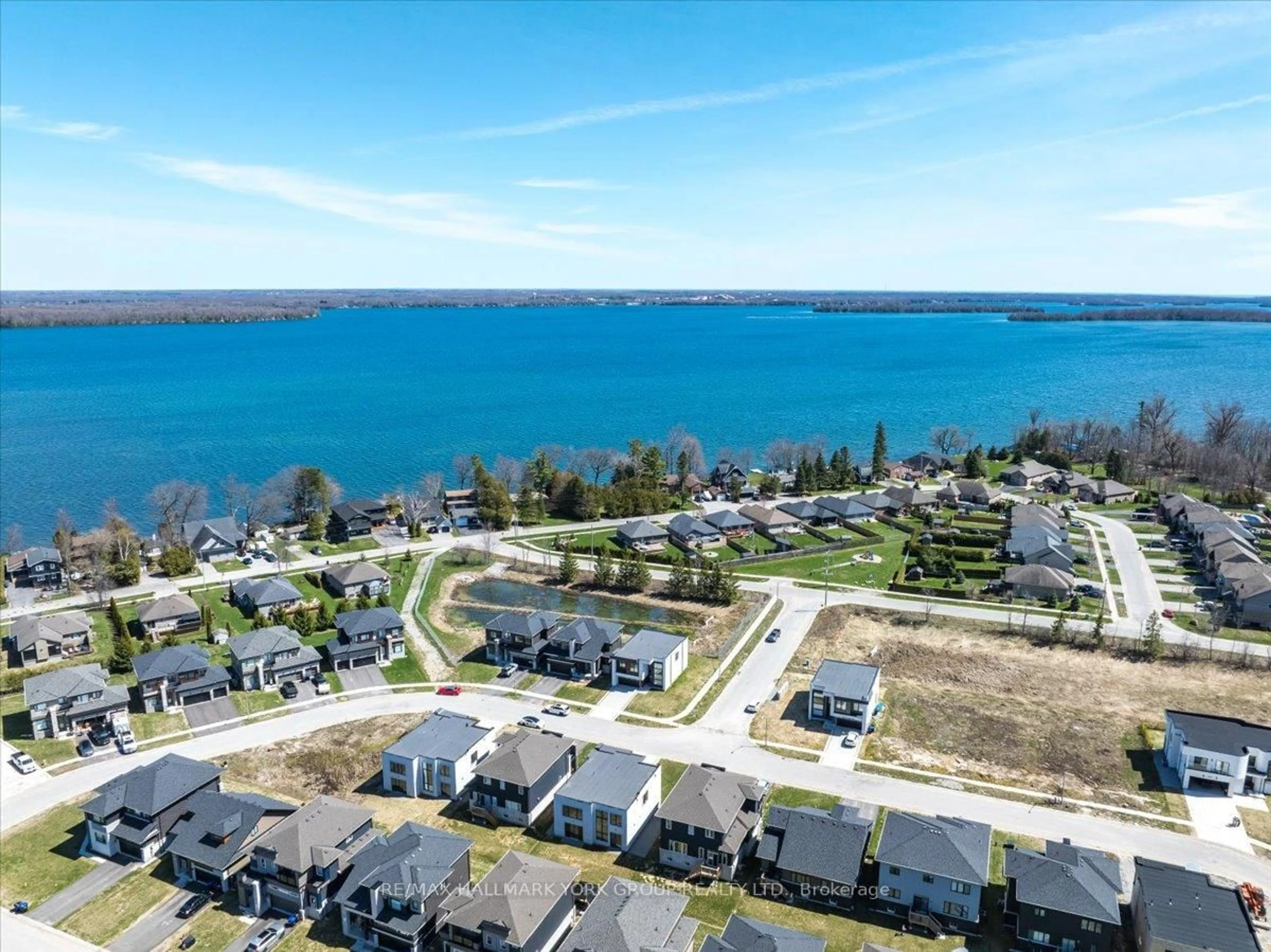 A pic from outside/outdoor area/front of a property/back of a property/a pic from drone, water/lake/river/ocean view for 3740 Lakepoint Dr, Severn Ontario L3V 8N1