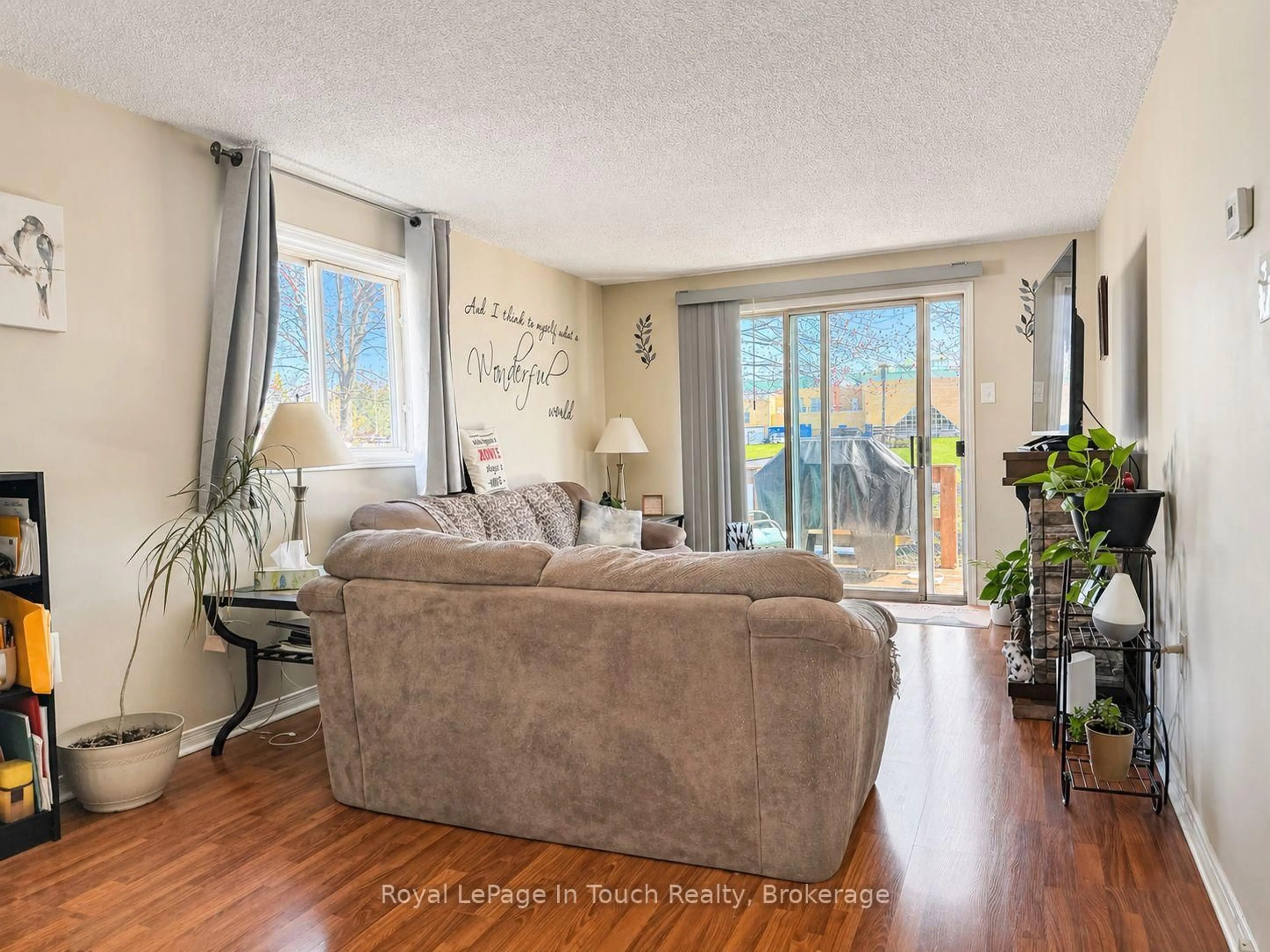 Living room with furniture, wood/laminate floor for 726 Frazer Dr, Midland Ontario L4R 5C7