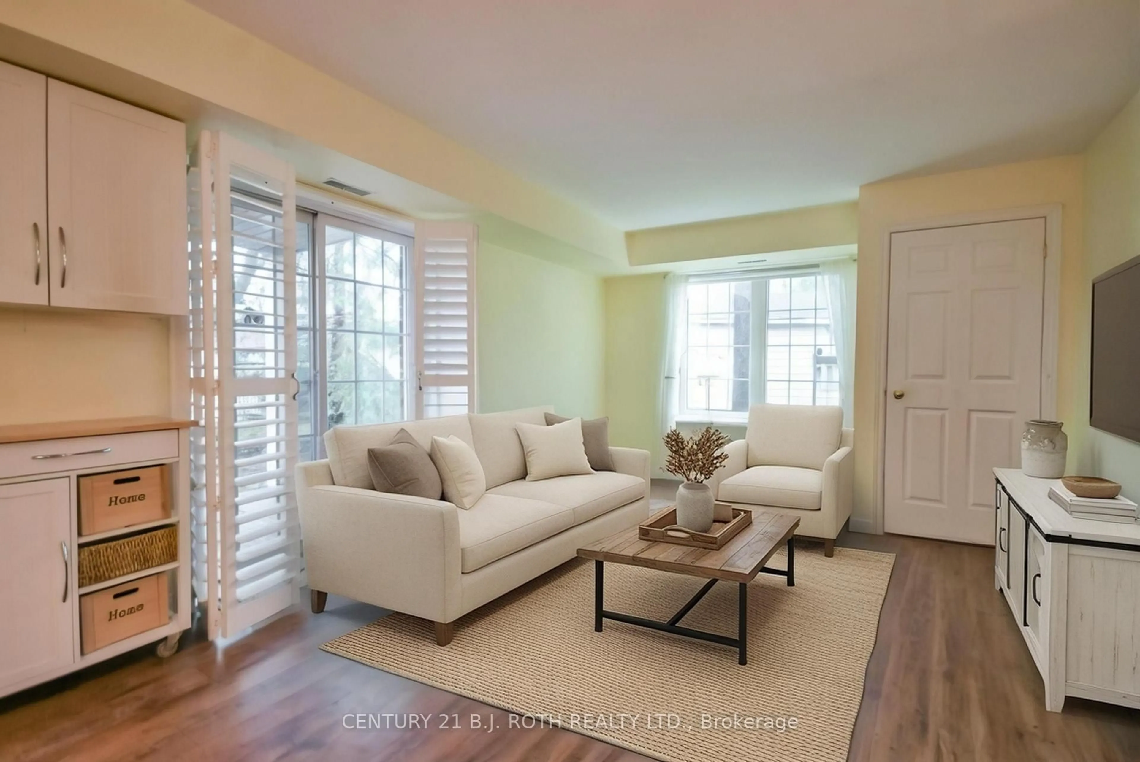 Living room with furniture, wood/laminate floor for 49 Jacobs Terr #114, Barrie Ontario L4N 0W4