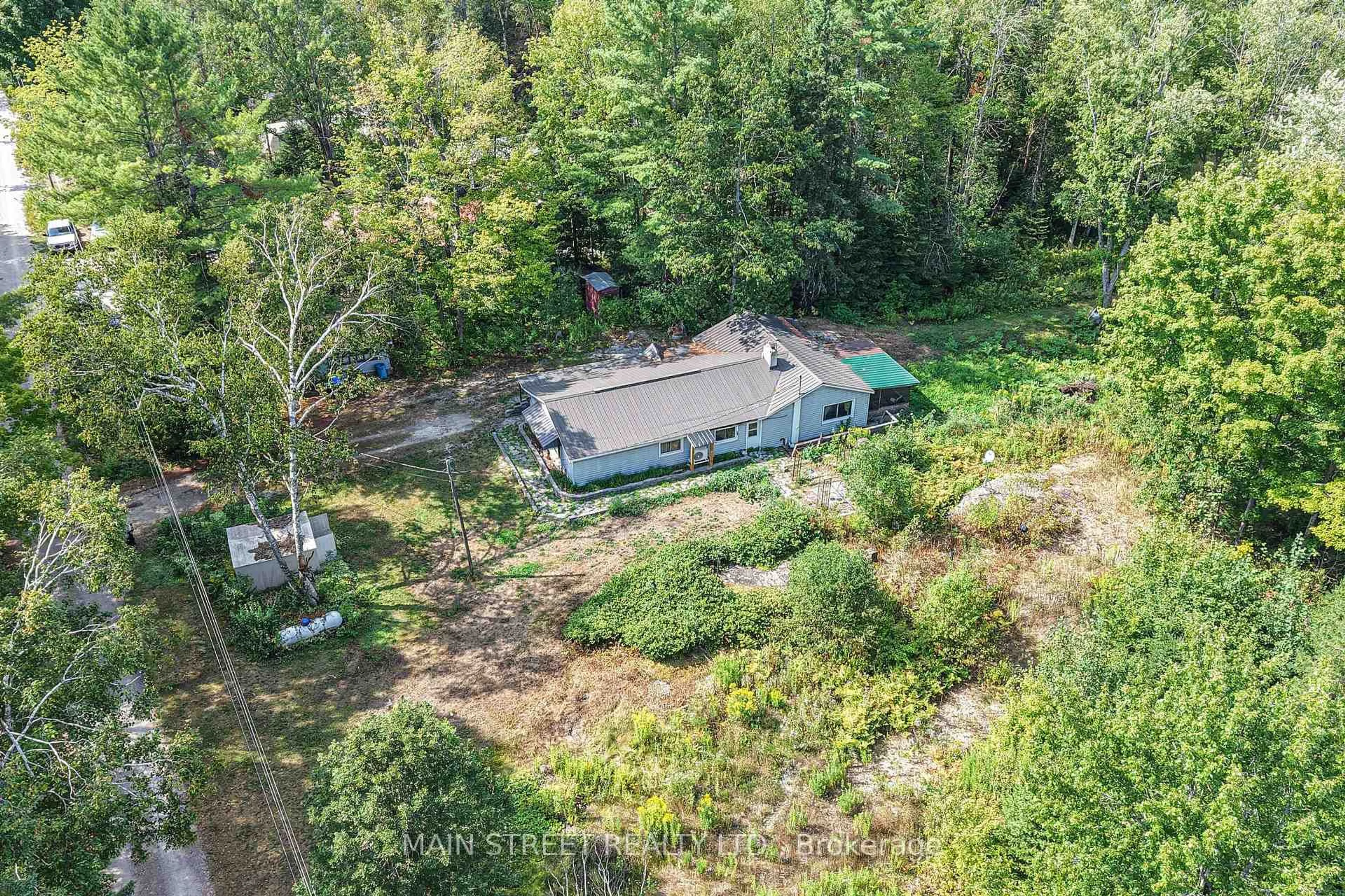 A pic from outside/outdoor area/front of a property/back of a property/a pic from drone, forest/trees view for 6583 Pioneer Village Line, Ramara Ontario L0K 1W0