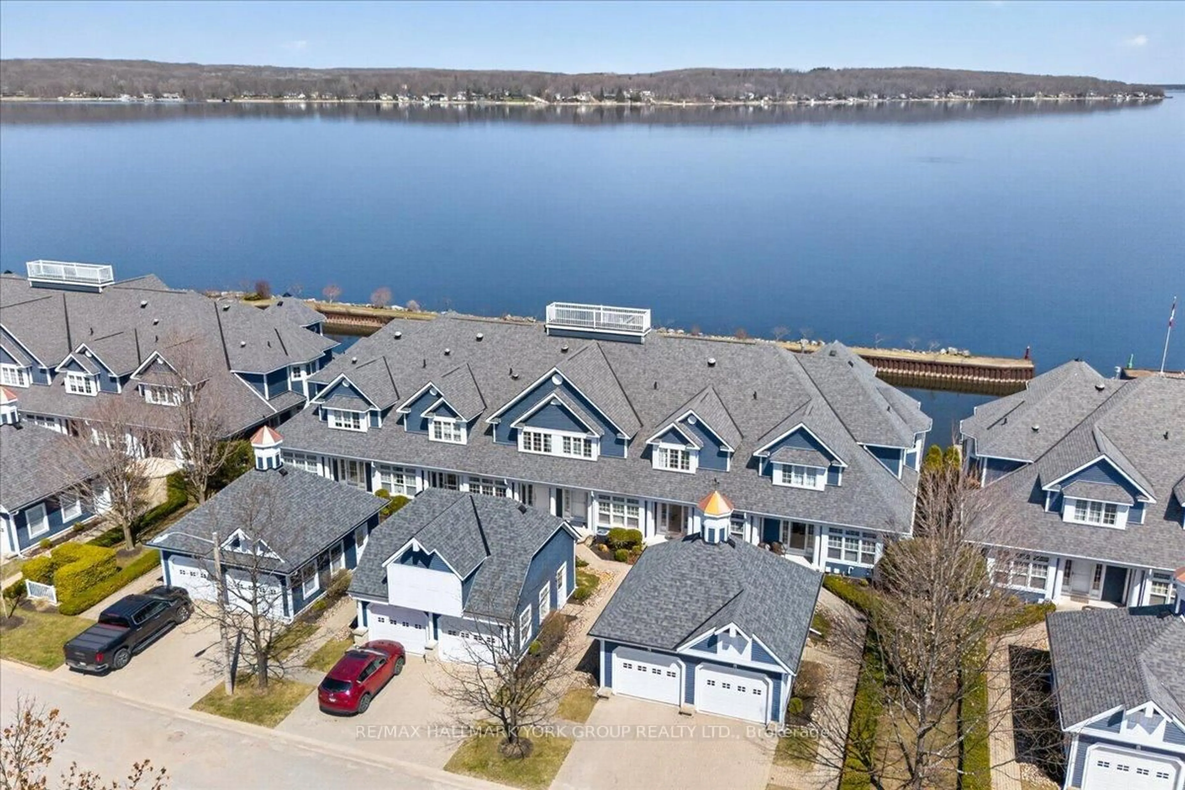 A pic from outside/outdoor area/front of a property/back of a property/a pic from drone, water/lake/river/ocean view for 155 William St #10, Midland Ontario L4R 5N1