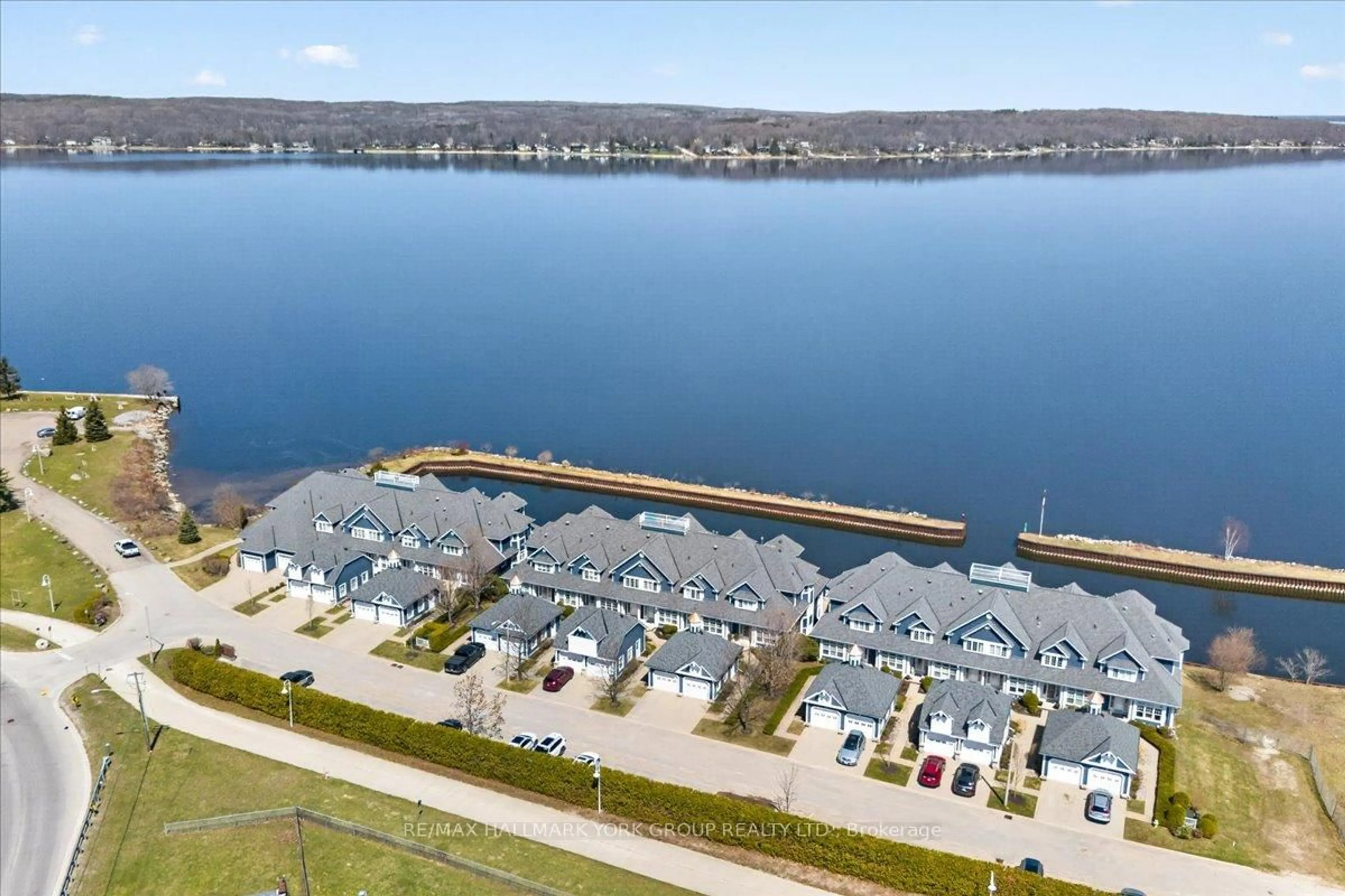 A pic from outside/outdoor area/front of a property/back of a property/a pic from drone, water/lake/river/ocean view for 155 William St #10, Midland Ontario L4R 5N1