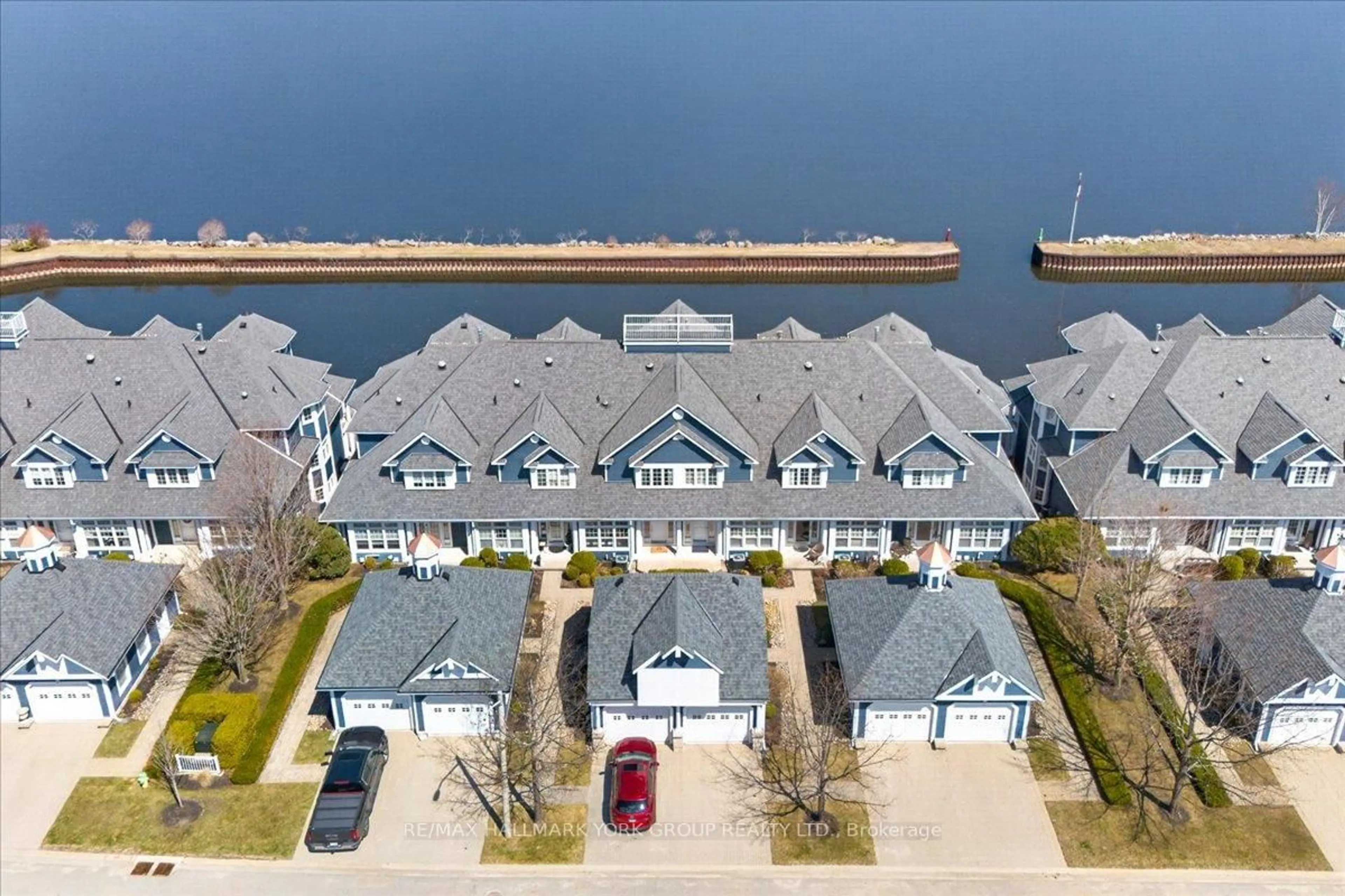 A pic from outside/outdoor area/front of a property/back of a property/a pic from drone, water/lake/river/ocean view for 155 William St #10, Midland Ontario L4R 5N1