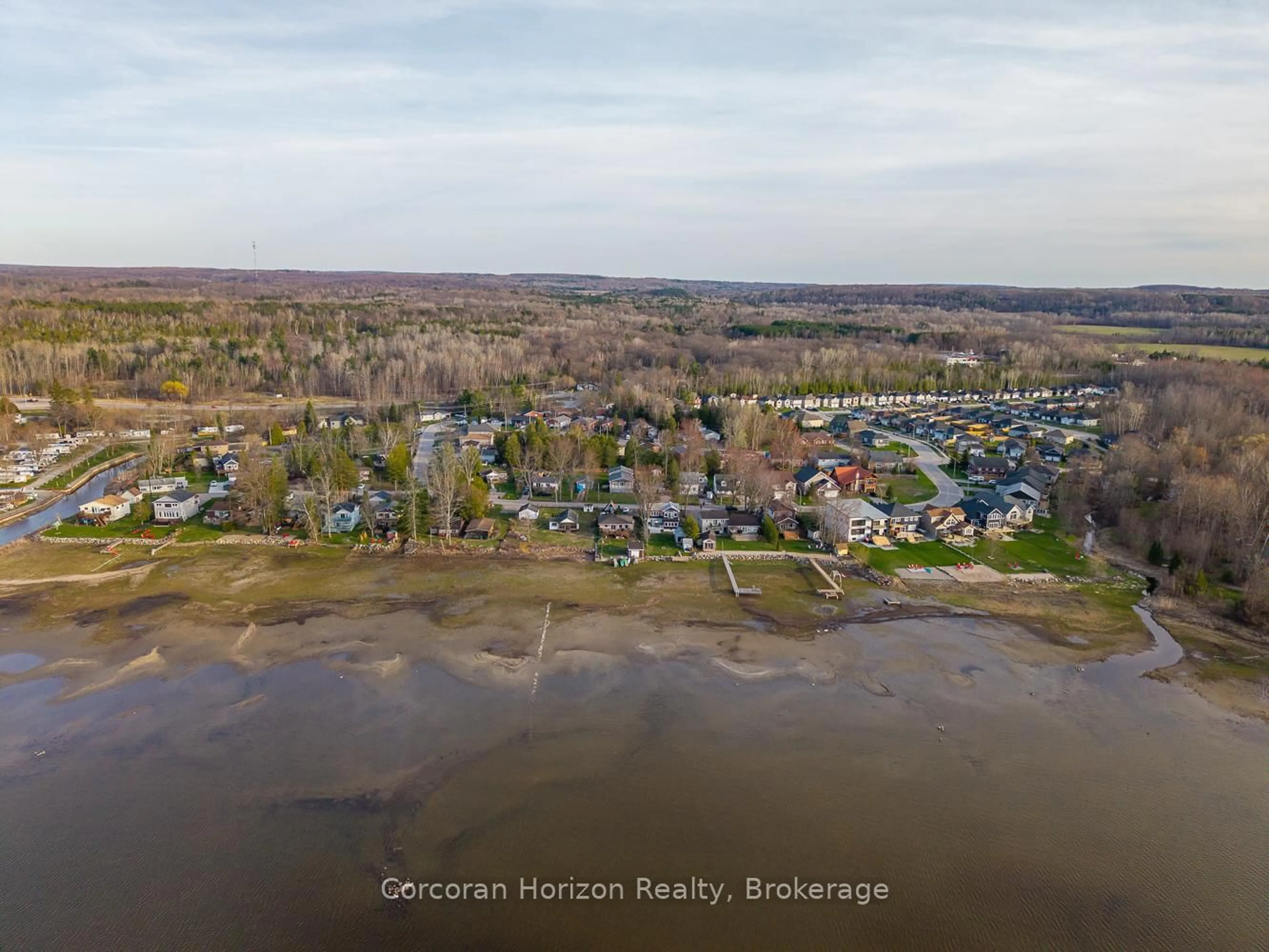 A pic from outside/outdoor area/front of a property/back of a property/a pic from drone, water/lake/river/ocean view for 555 O'Leary Lane, Tay Ontario L0K 2A0