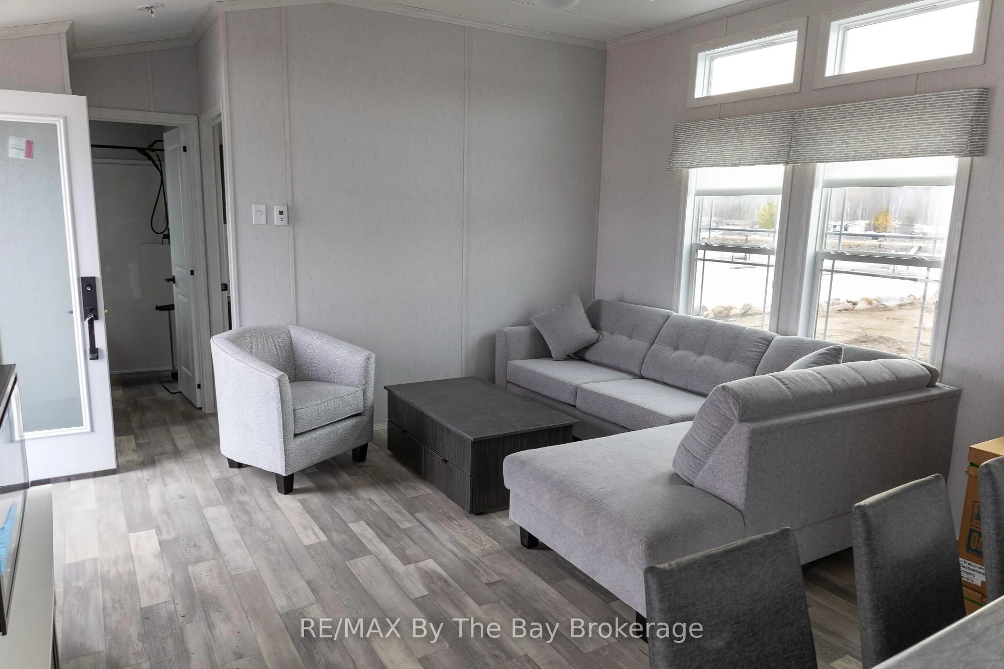 Living room with furniture, unknown for 3282 Ogdens Beach Rd #62, Midland Ontario L9S 2K6