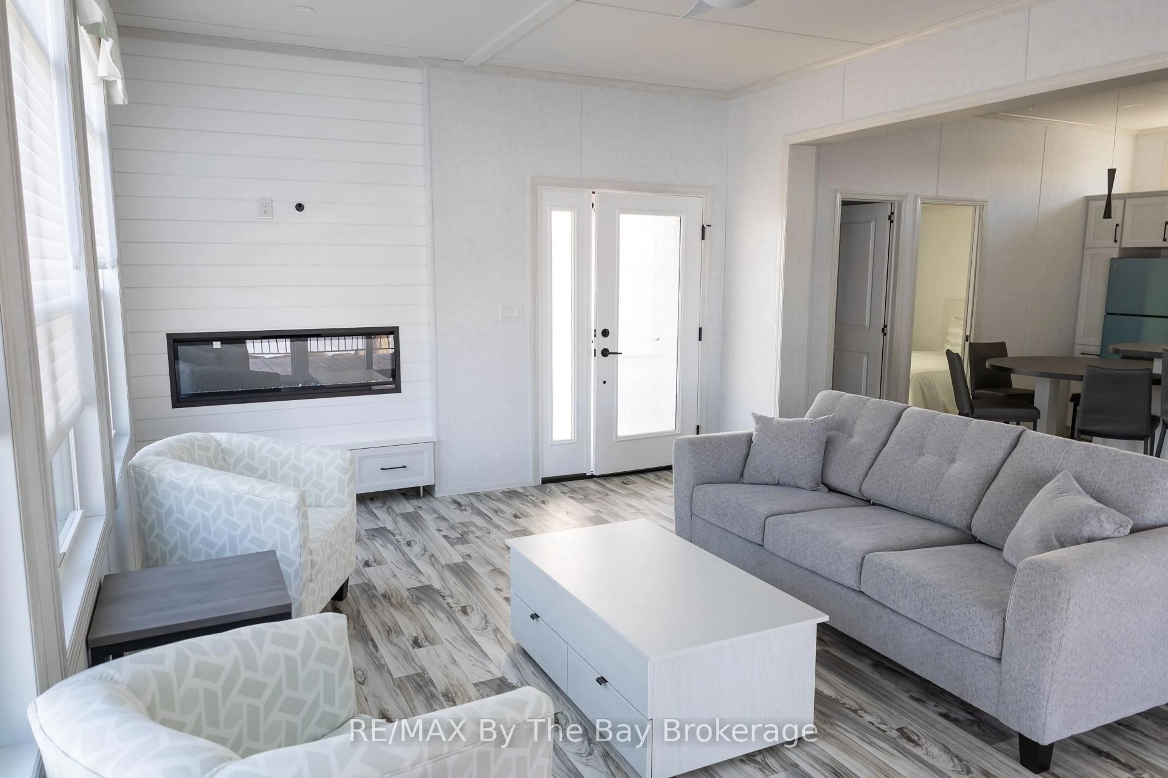 Living room with furniture, unknown for 3282 Ogdens Beach Rd #49, Tay Ontario L9S 2K6