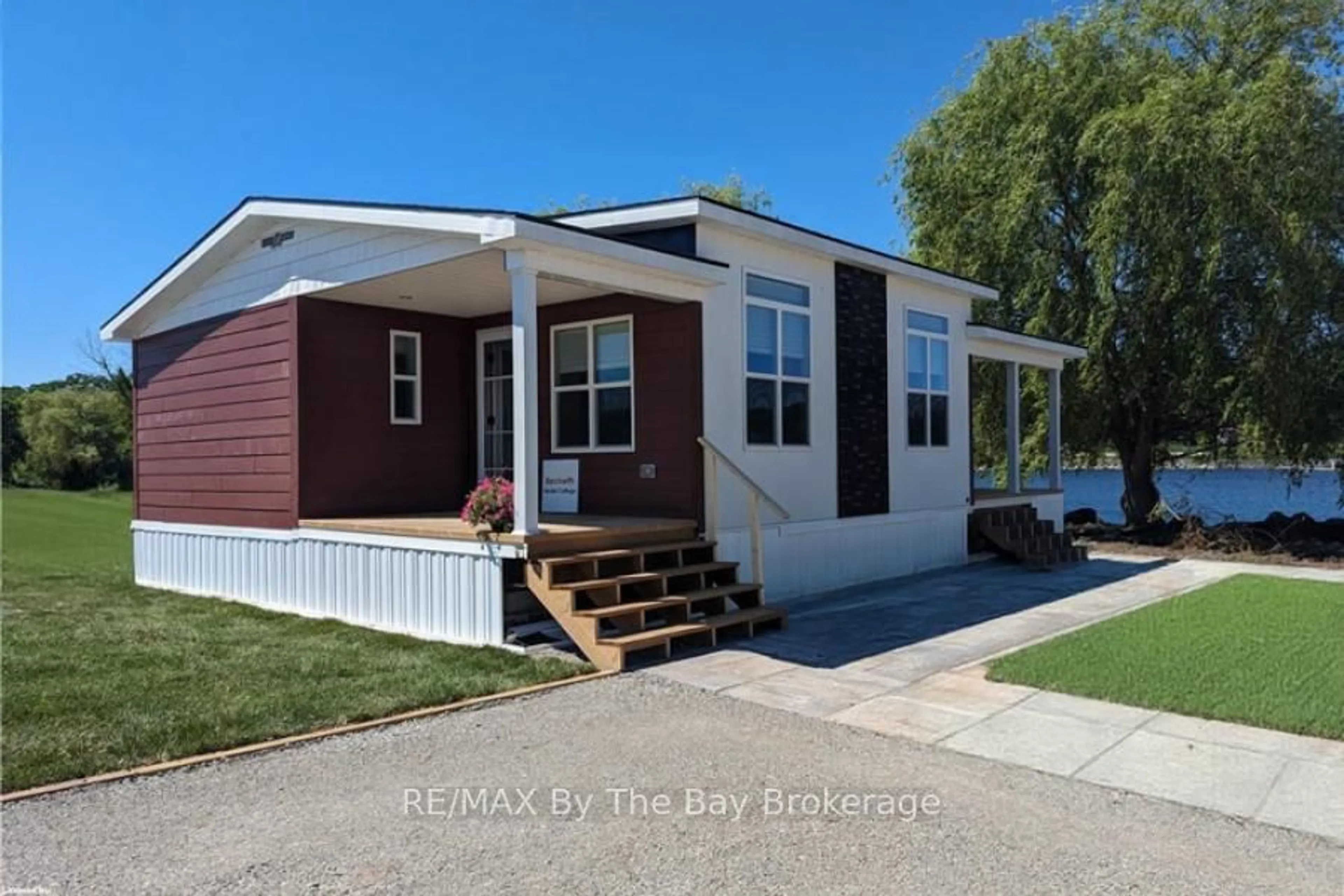 Home with vinyl exterior material, street for 3282 Ogdens Beach Rd #47, Midland Ontario L9S 2K6