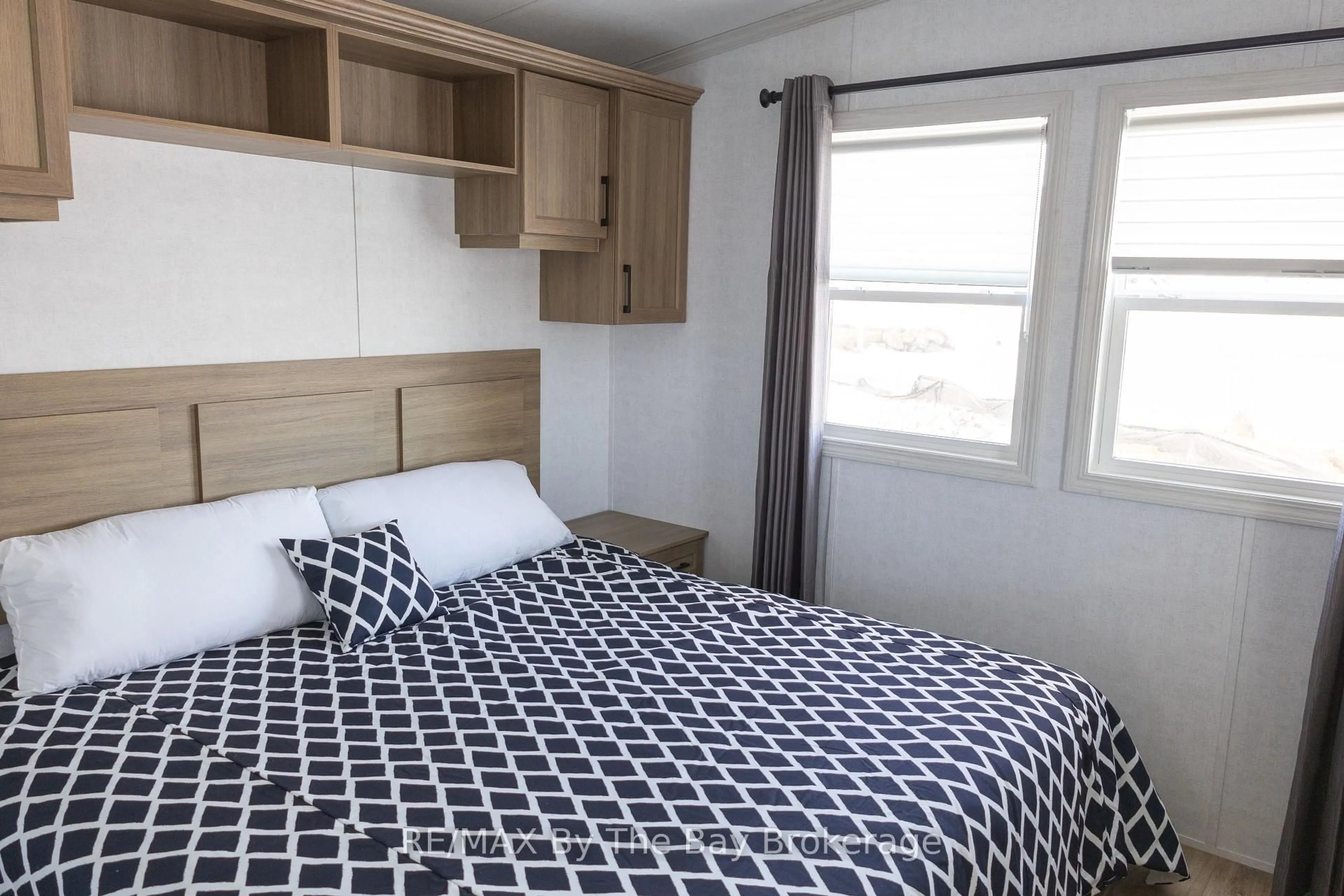 Bedroom with bed, unknown for 3282 Ogdens Beach Rd #44, Tay Ontario L9S 2K6