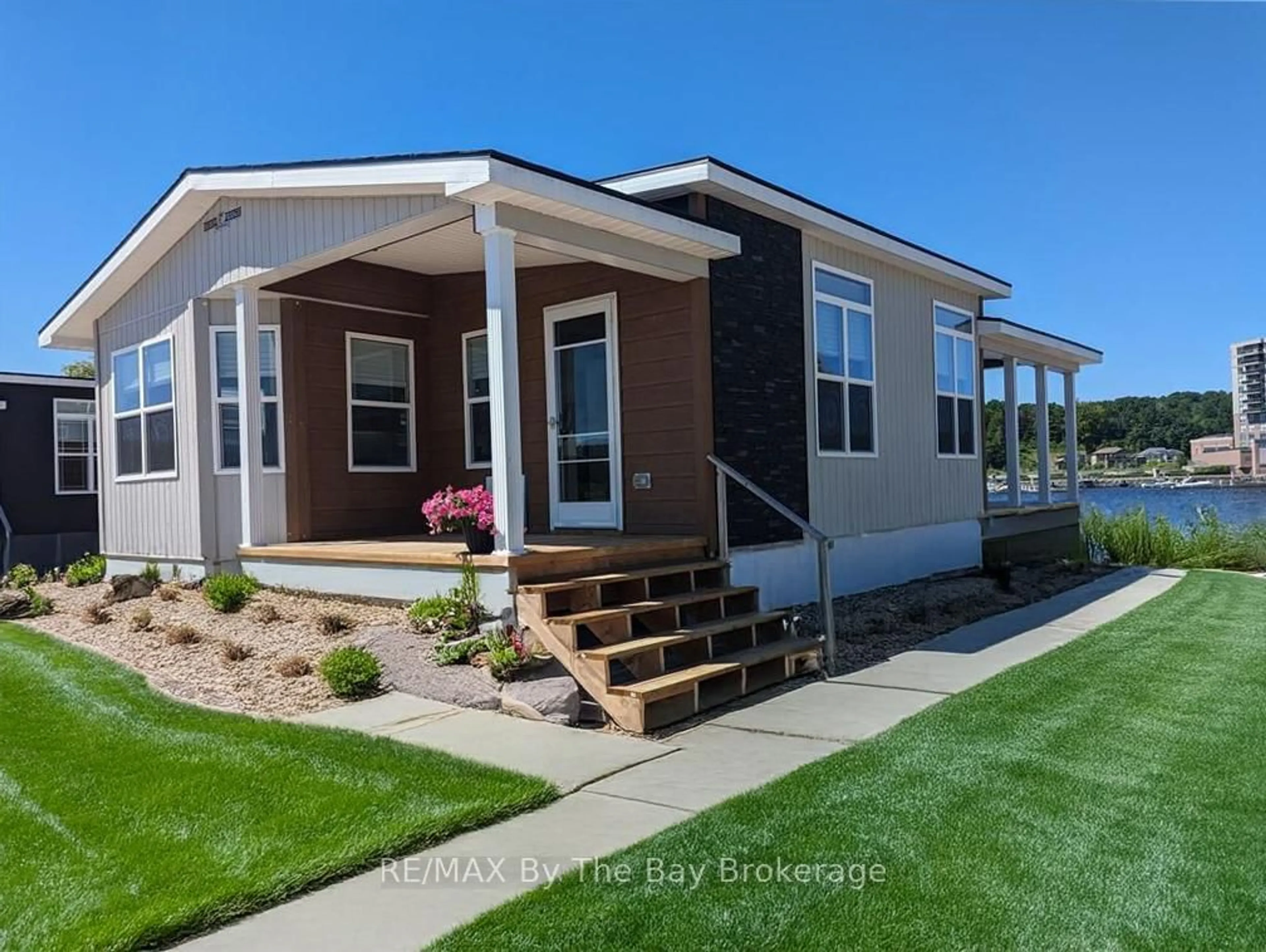 Home with vinyl exterior material, building for 3282 Ogdens Beach Rd #51, Tay Ontario L9S 2K6