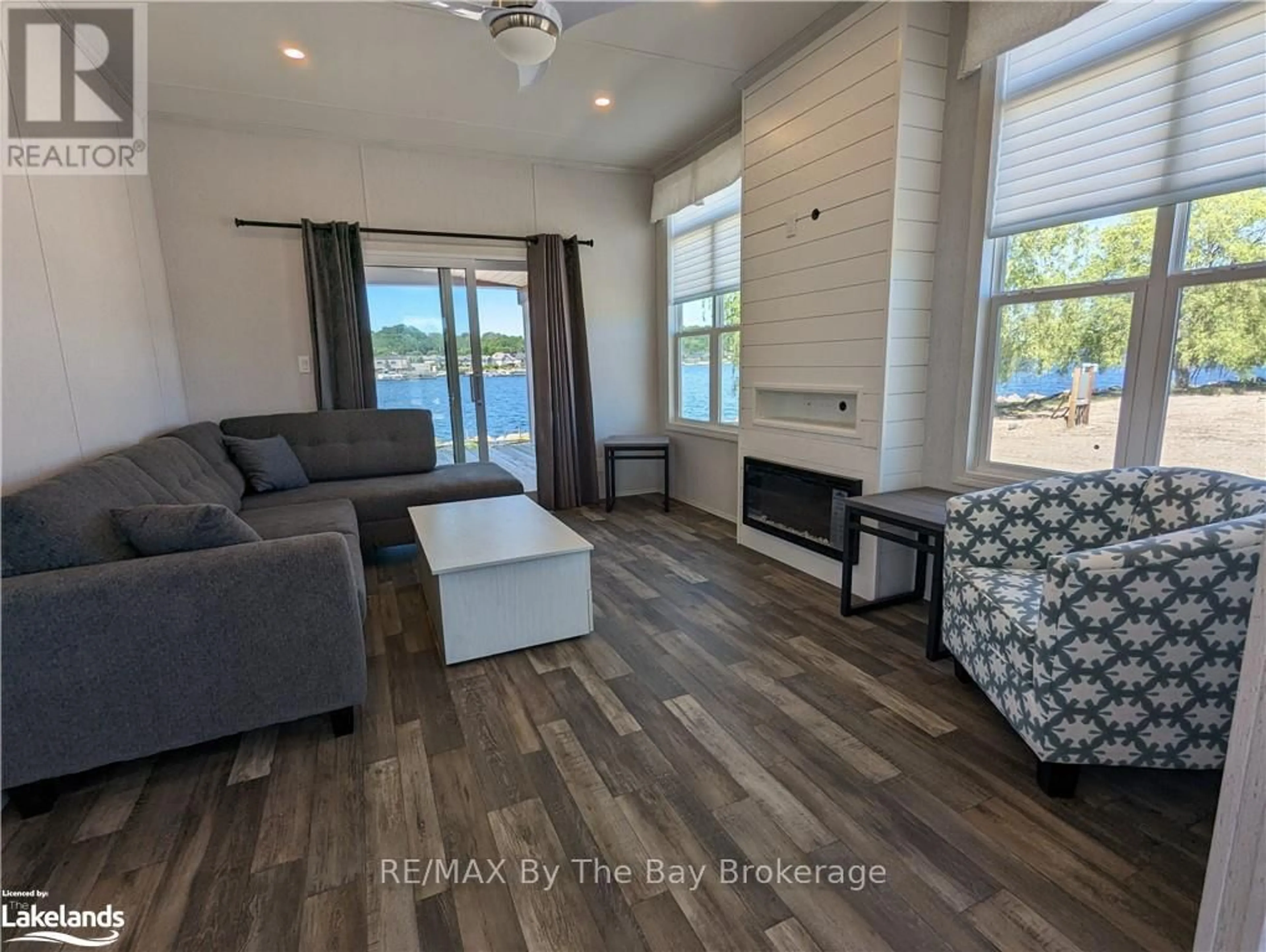 Living room with furniture, unknown for 3282 Ogdens Beach Rd #51, Tay Ontario L9S 2K6