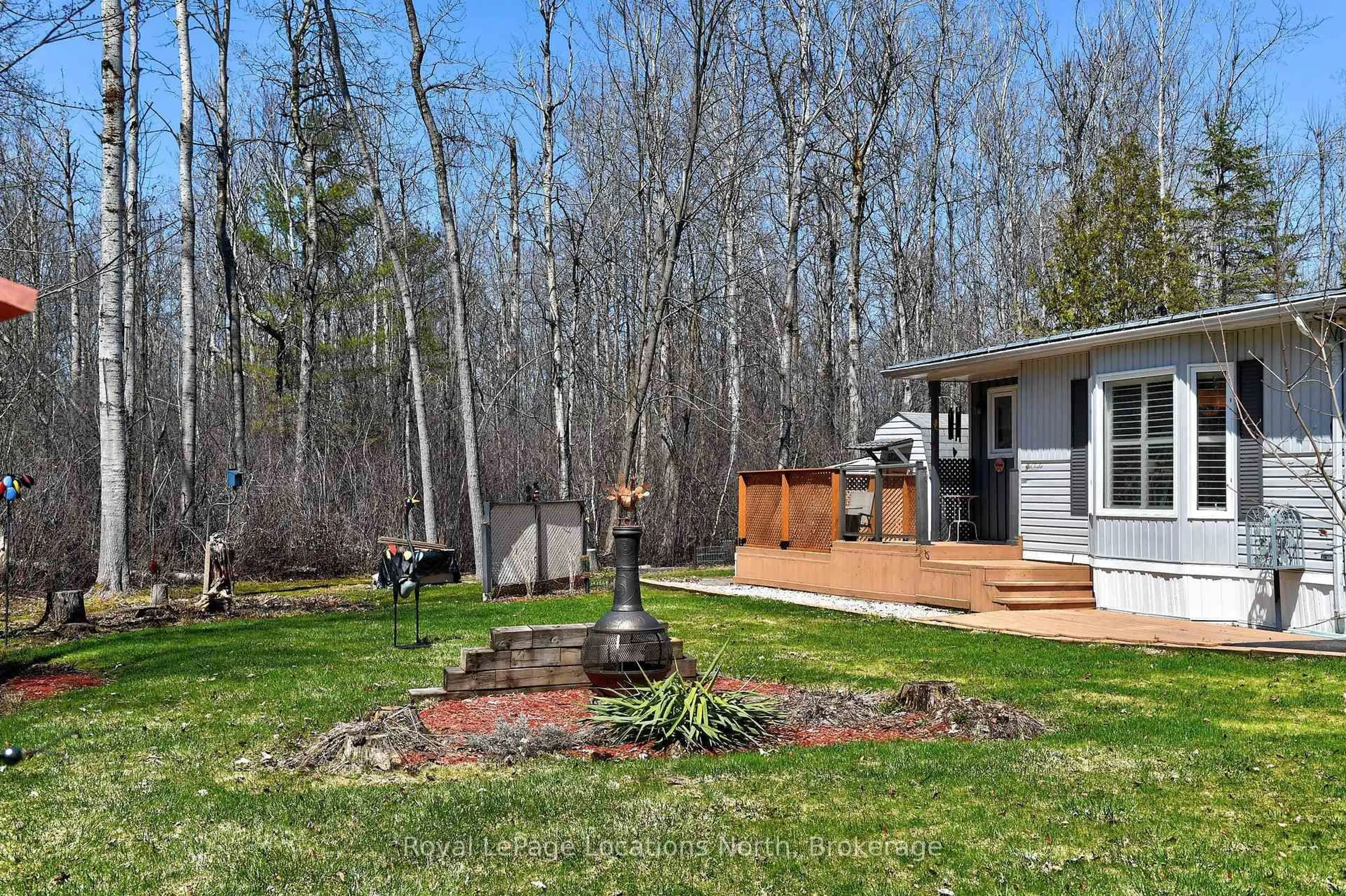 Patio, forest/trees view for 18 Prince Charles Ave, Springwater Ontario L0L 1P0