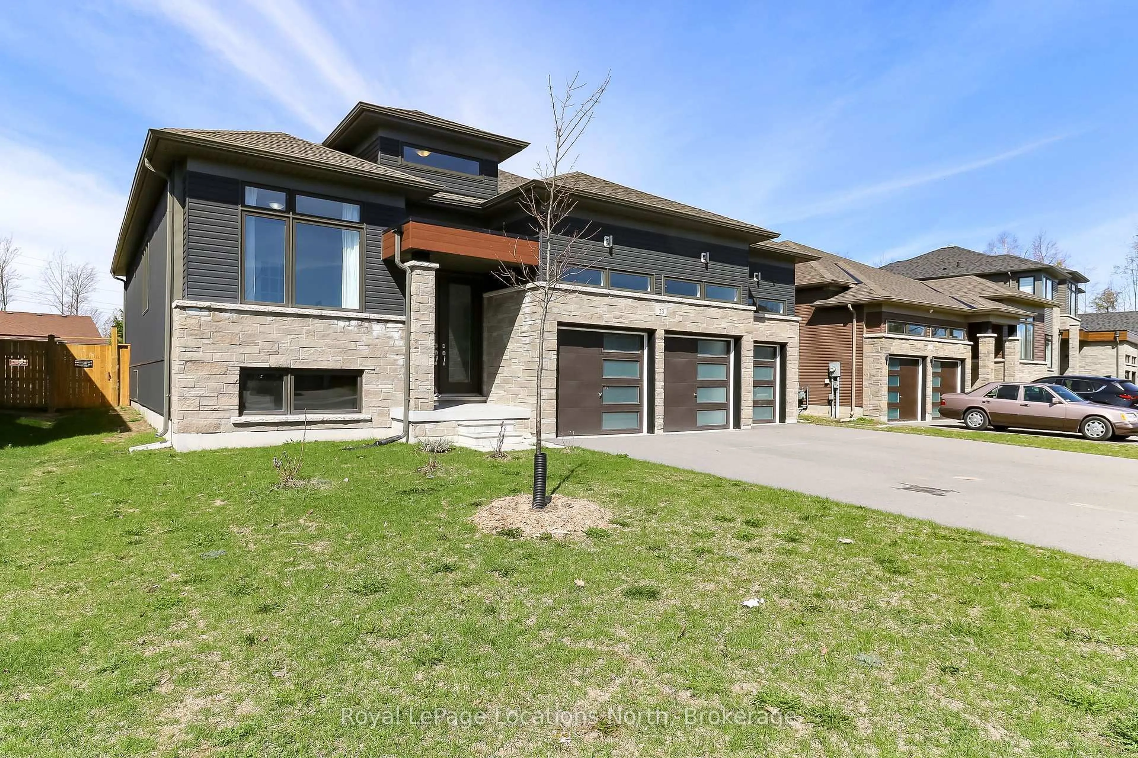 Home with brick exterior material, street for 23 Beatrice Dr, Wasaga Beach Ontario L9Z 0L3