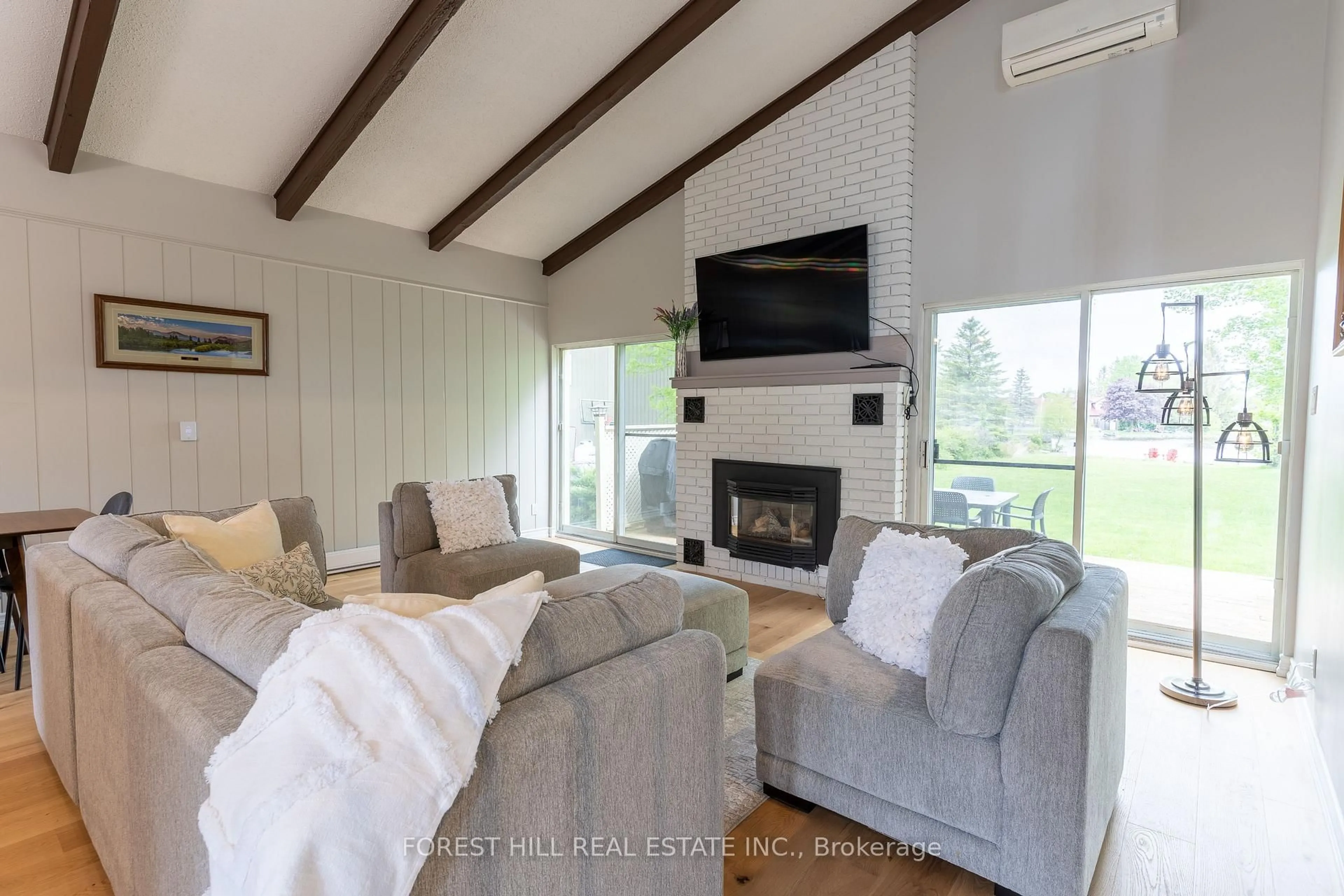 Living room with furniture, wood/laminate floor for 35 Turtle Path, Ramara Ontario L0K 1B0