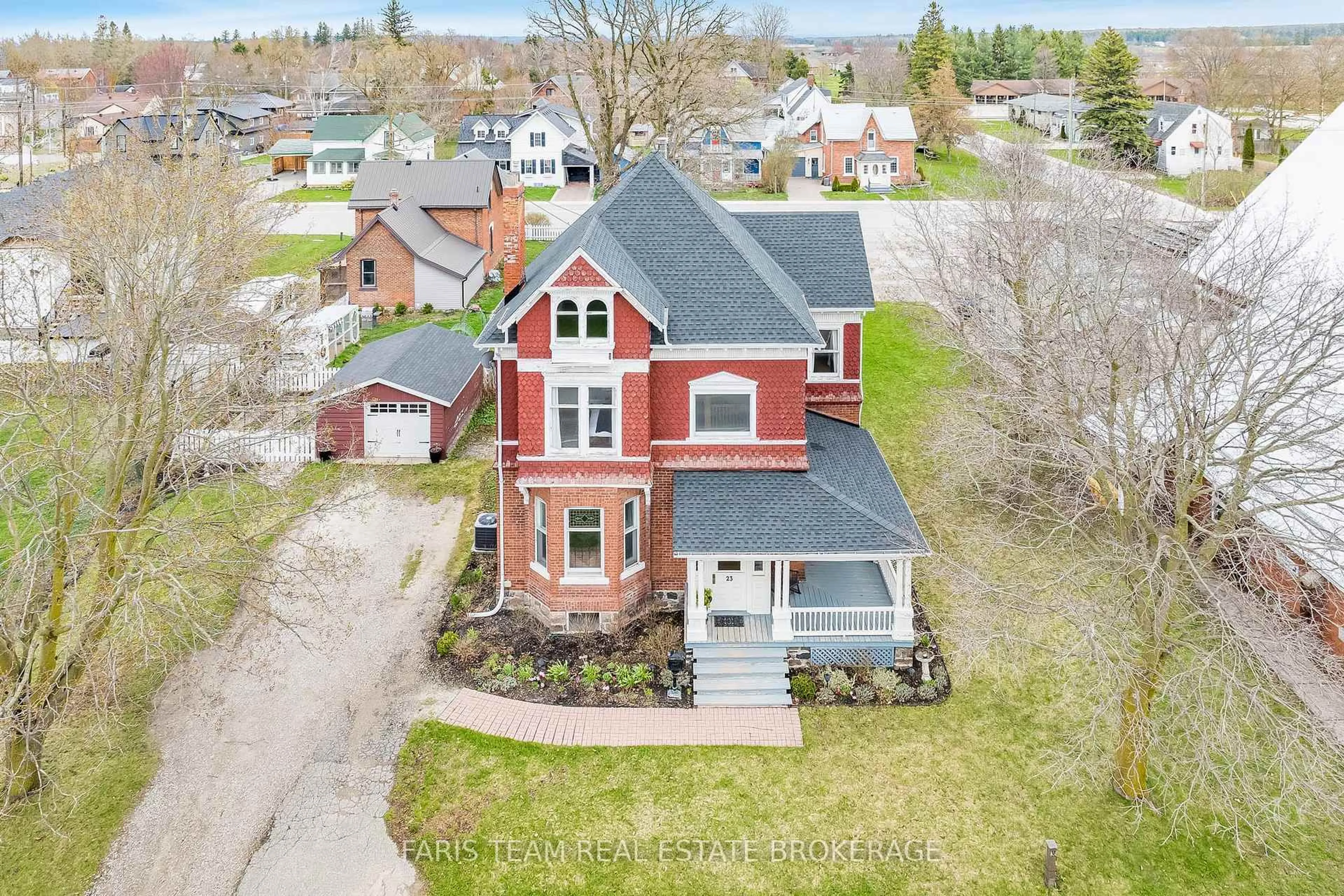 A pic from outside/outdoor area/front of a property/back of a property/a pic from drone, street for 23 Yonge St, Springwater Ontario L0L 1P0