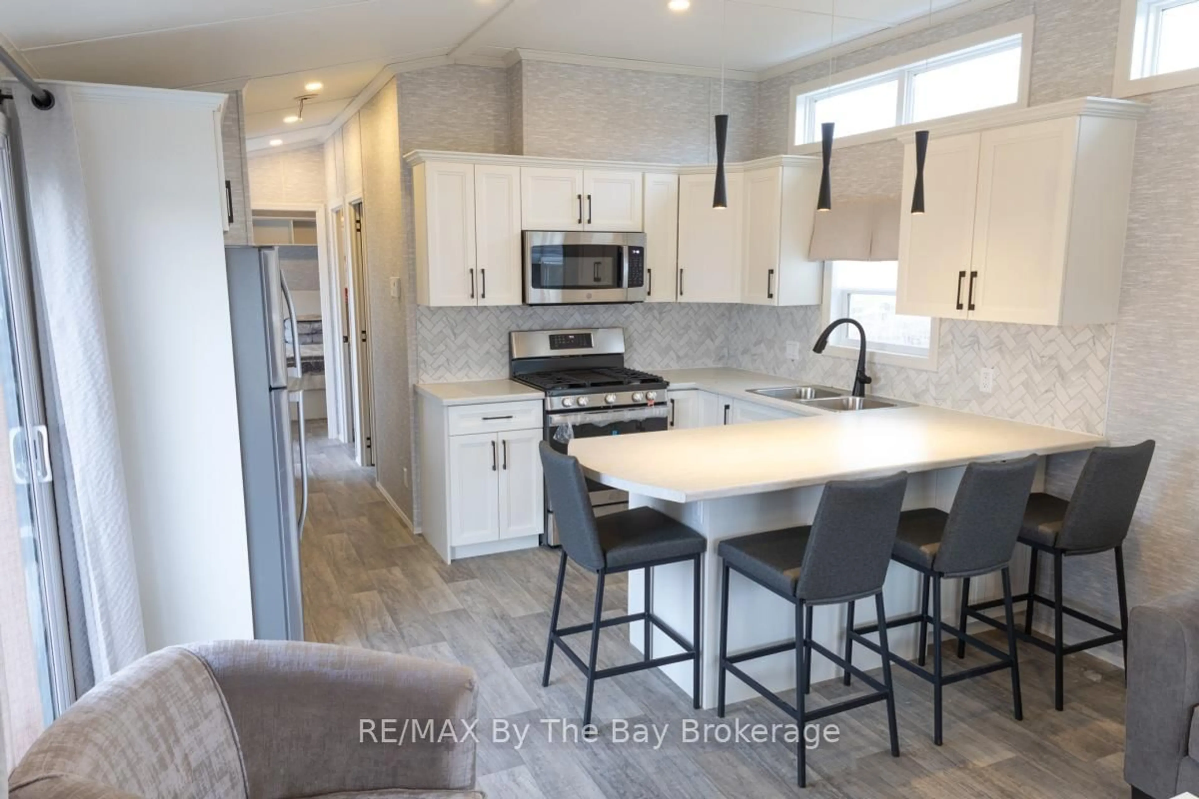 Open concept kitchen, ceramic/tile floor for 3282 Ogdens Beach Rd #69, Tay Ontario L9S 2K6