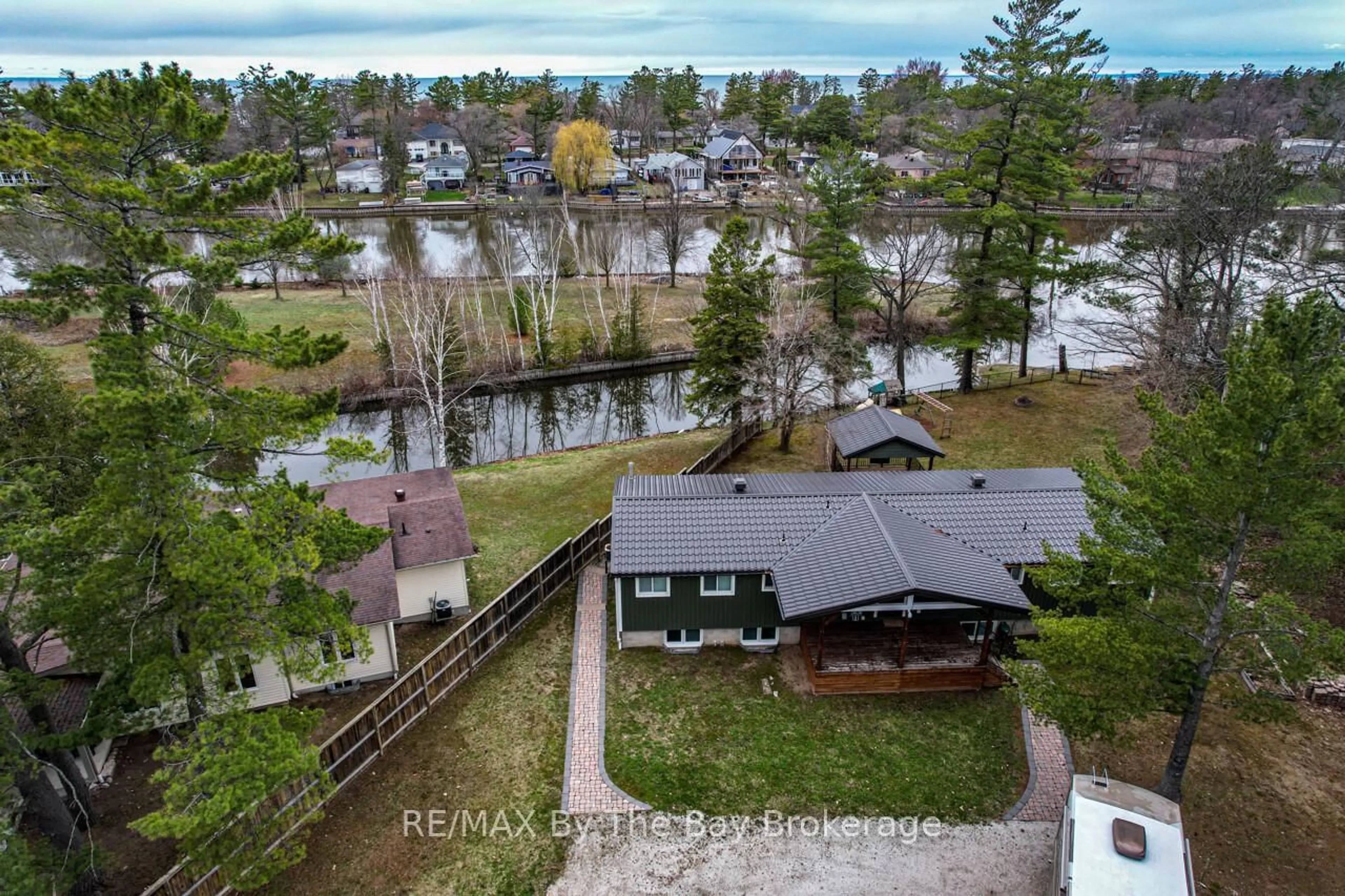 A pic from outside/outdoor area/front of a property/back of a property/a pic from drone, water/lake/river/ocean view for 1628 River Rd, Wasaga Beach Ontario L9Z 2S3