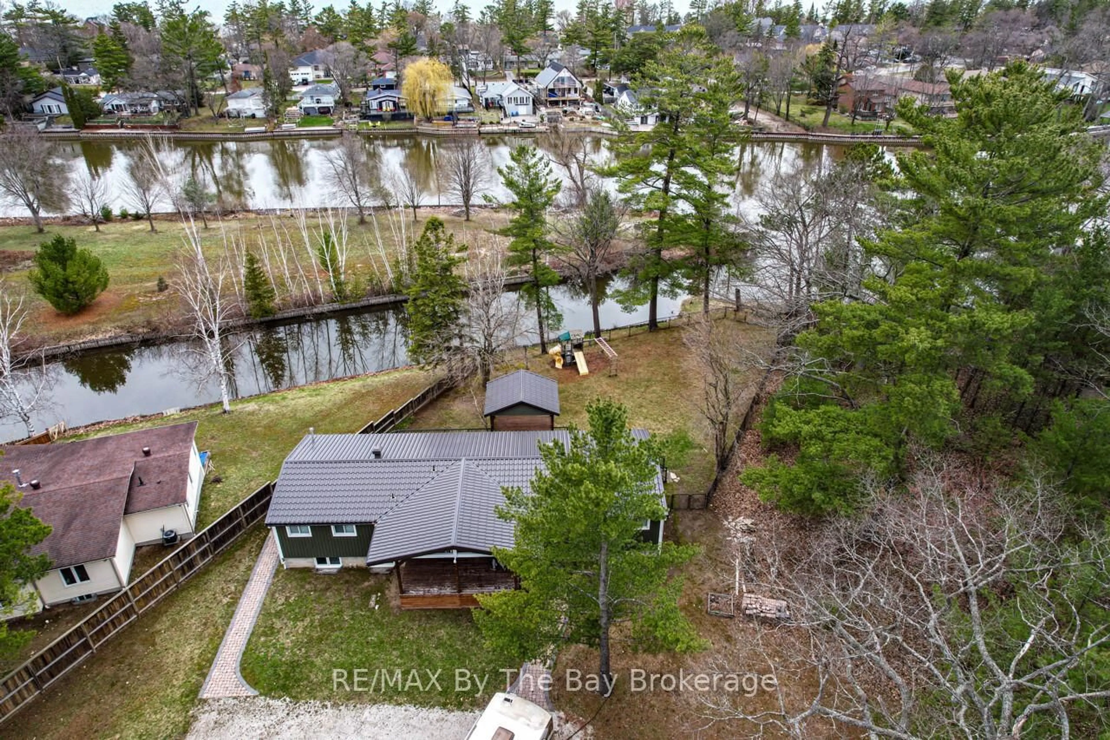 A pic from outside/outdoor area/front of a property/back of a property/a pic from drone, water/lake/river/ocean view for 1628 River Rd, Wasaga Beach Ontario L9Z 2S3