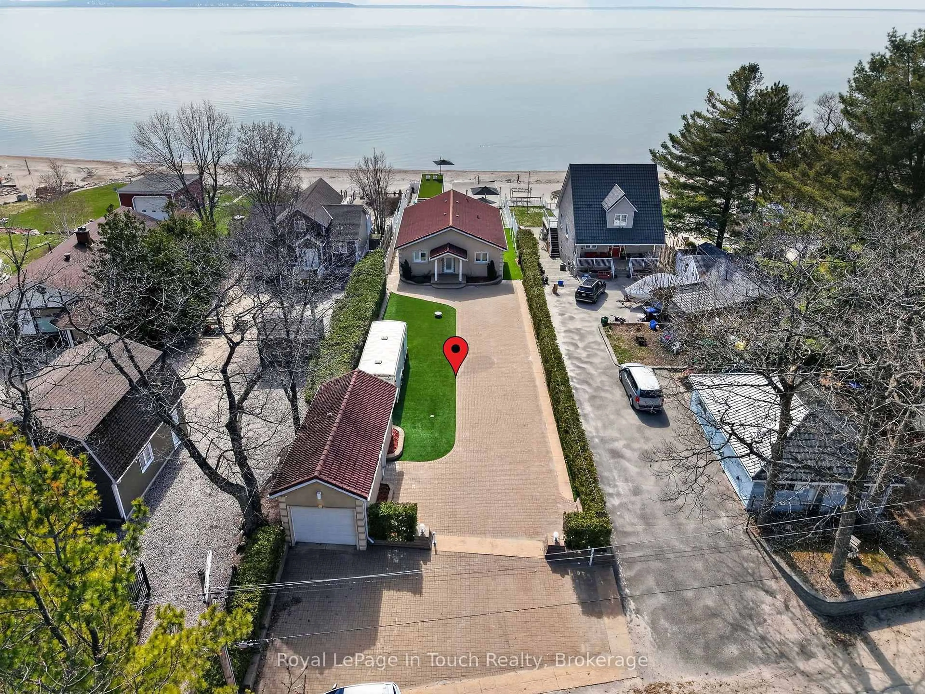 A pic from outside/outdoor area/front of a property/back of a property/a pic from drone, street for 32 Tiny Beaches Rd, Tiny Ontario L0L 2J0