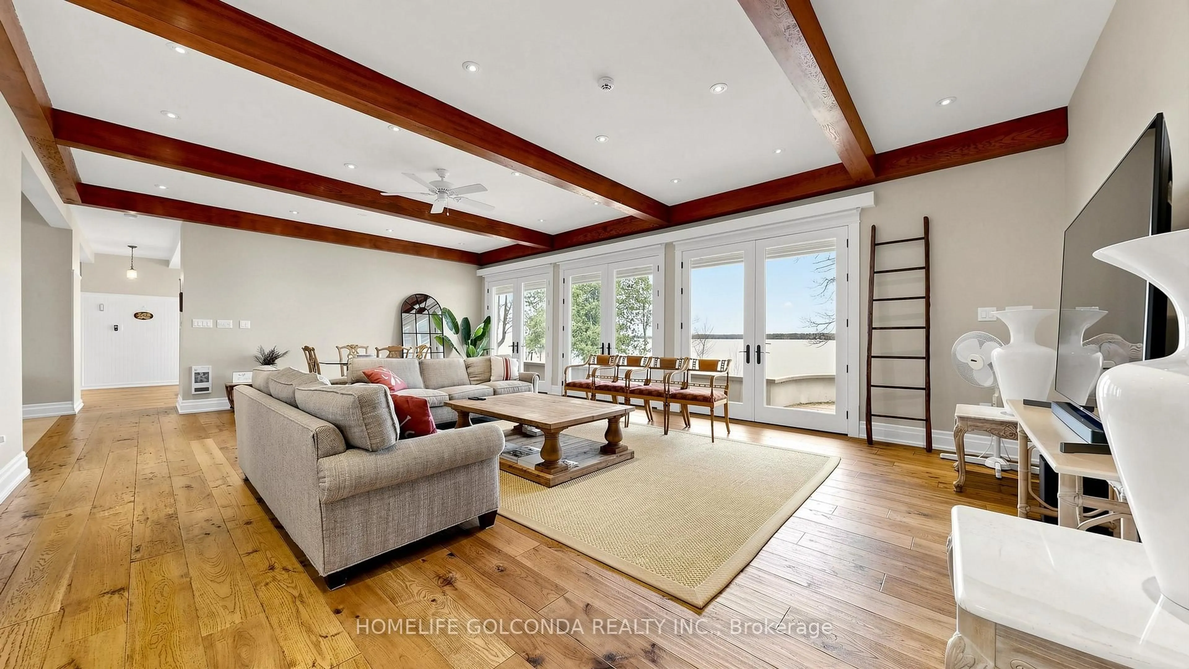 Living room with furniture, wood/laminate floor for 1811 Ridge Rd, Oro-Medonte Ontario L9S 3T7