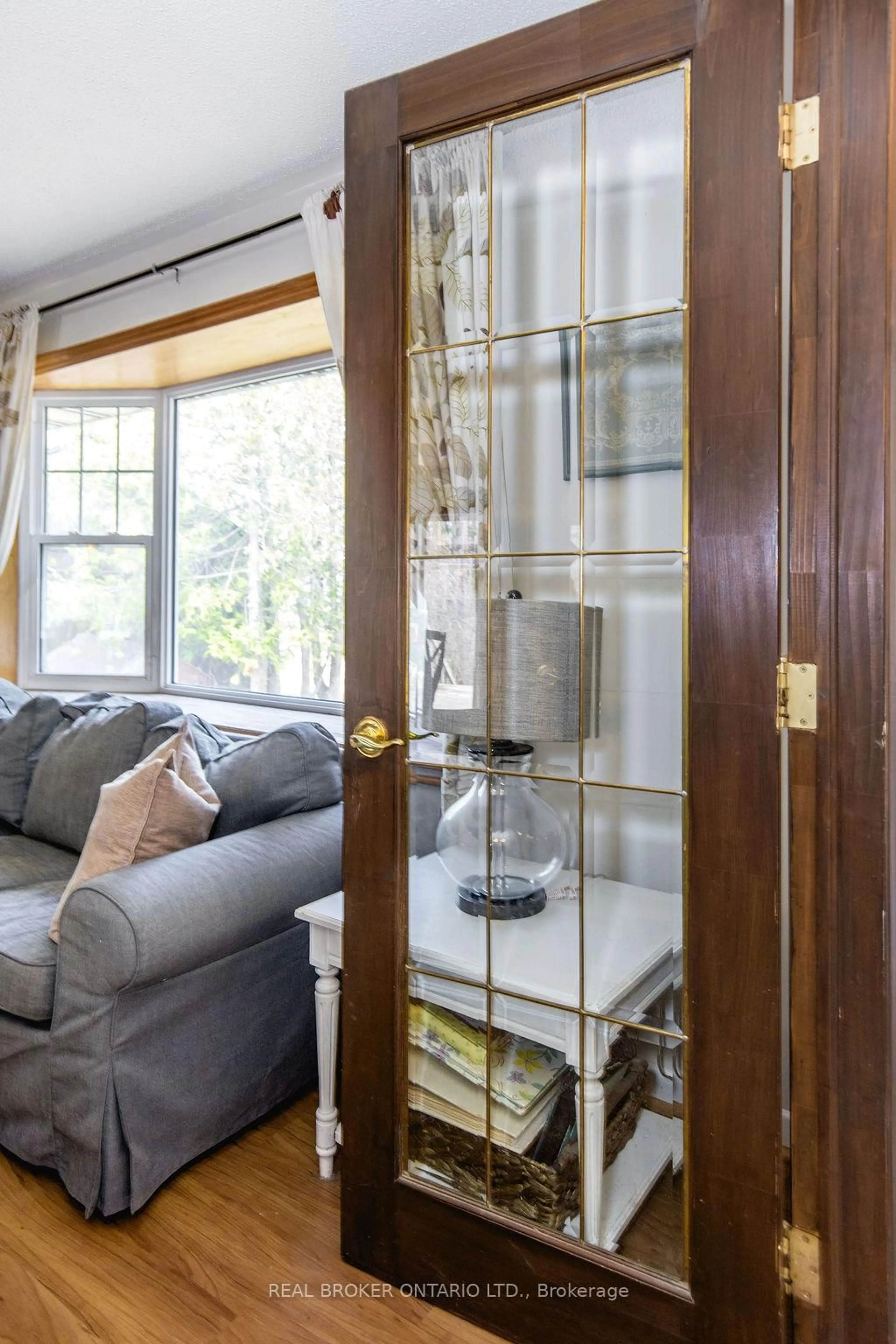 Living room with furniture, wood/laminate floor for 12 Alexander St, Springwater Ontario L9X 0W1