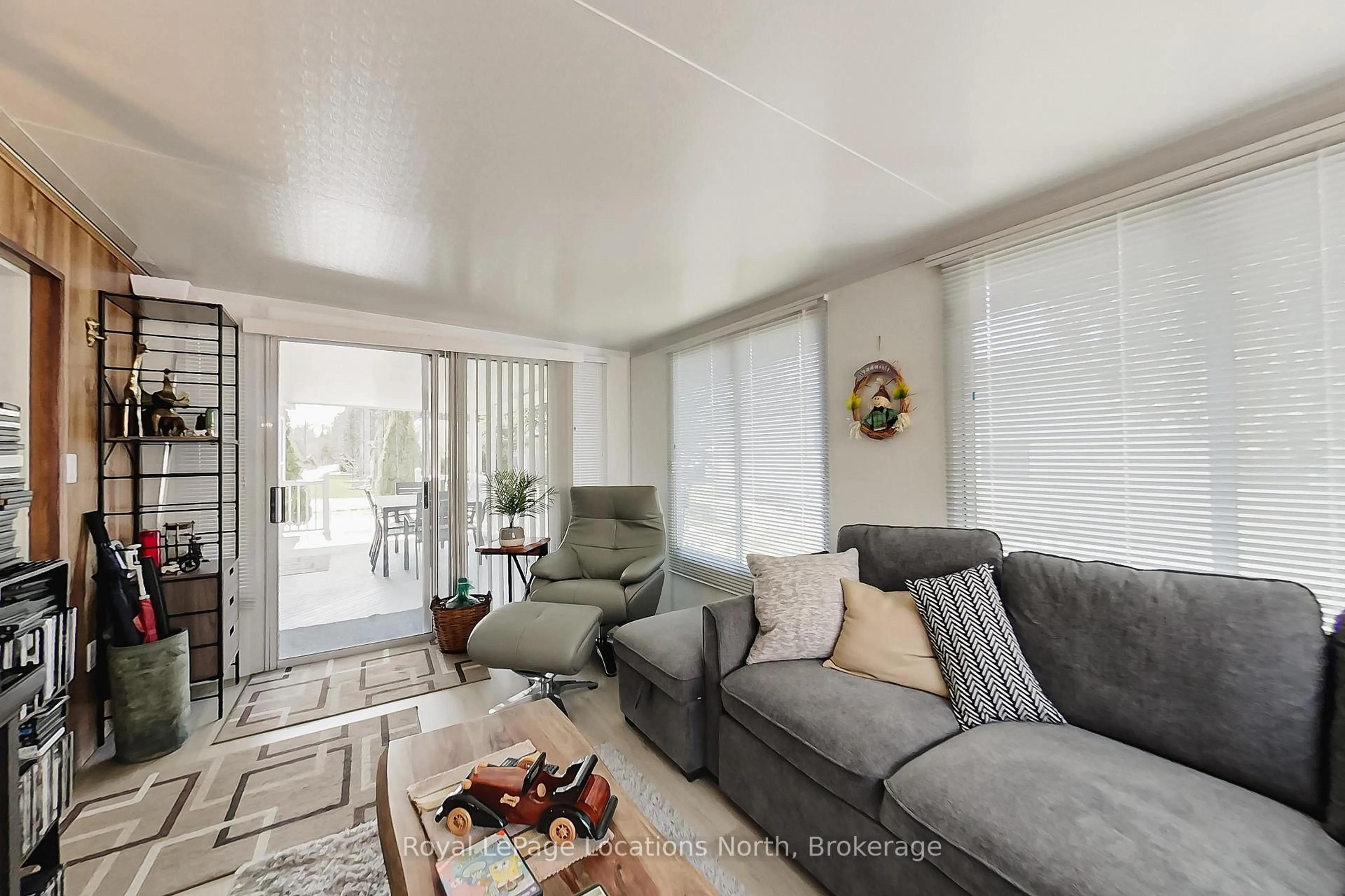 Living room with furniture, unknown for 2 Wasaga Pines Lane, Springwater Ontario L0L 1P0