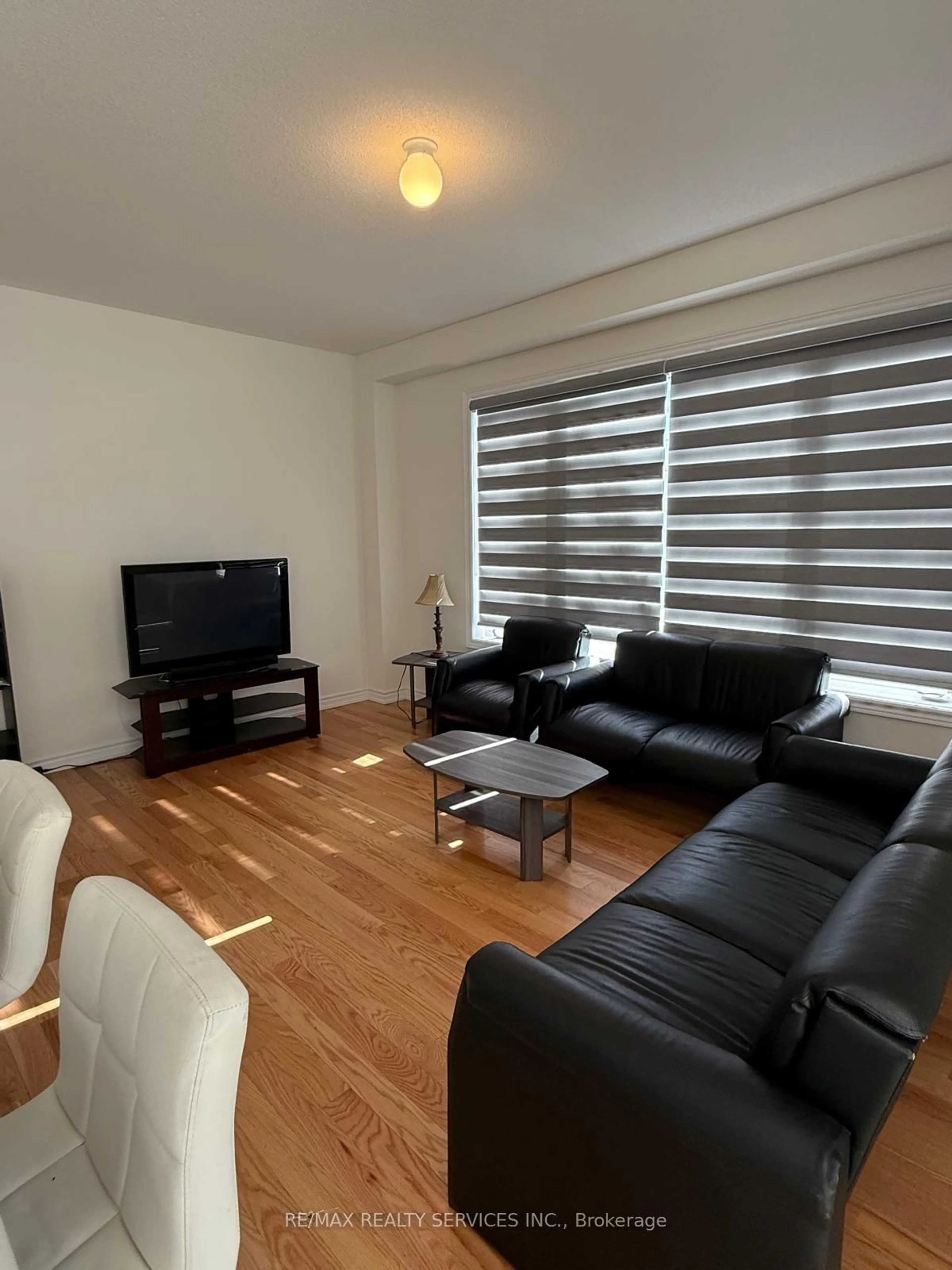 Living room with furniture, wood/laminate floor for 39 Prudhoe Terr, Barrie Ontario L9J 0W2