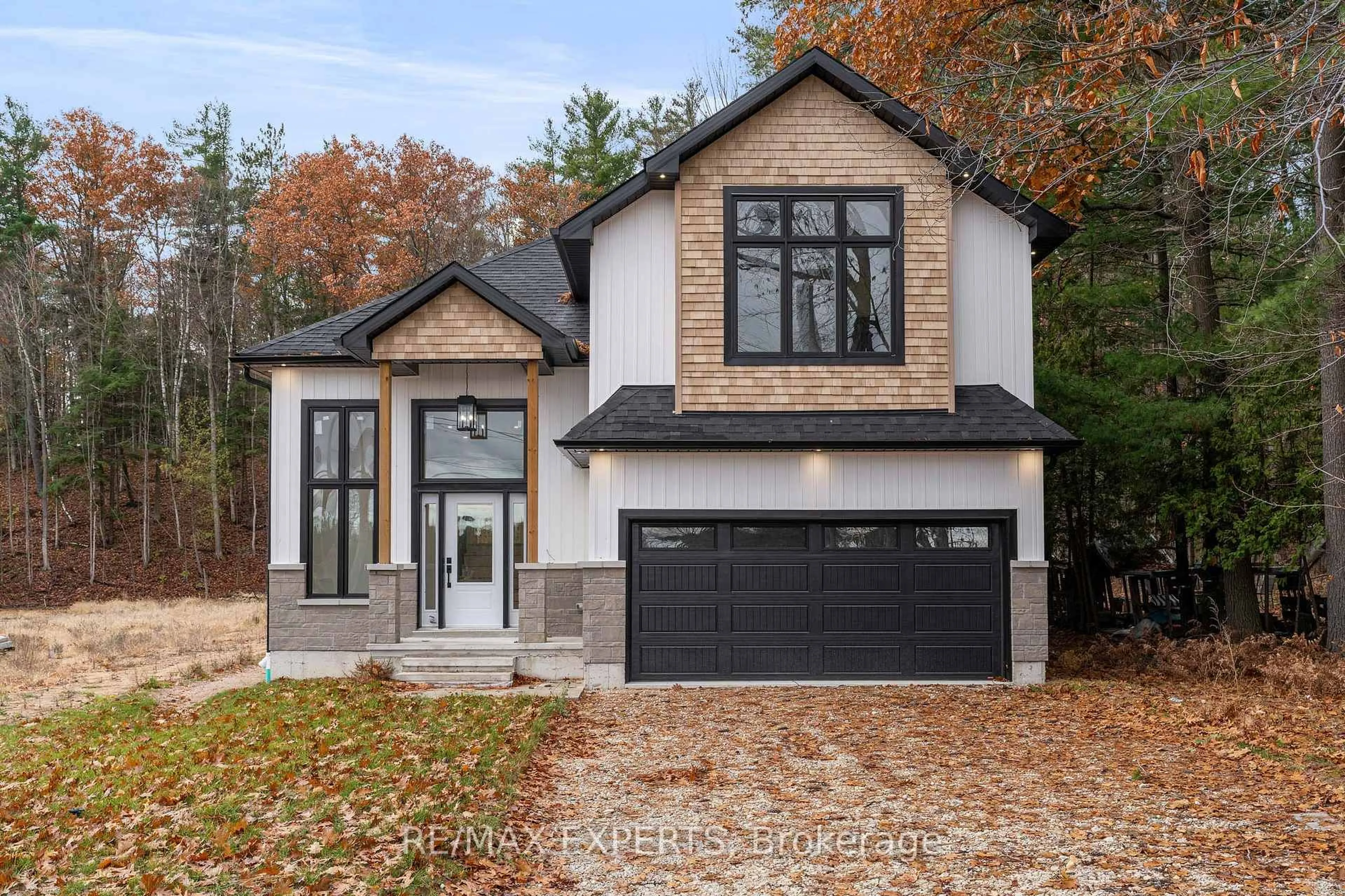 Home with brick exterior material, street for 506 Golf Course Rd, Wasaga Beach Ontario L9Z 1S5