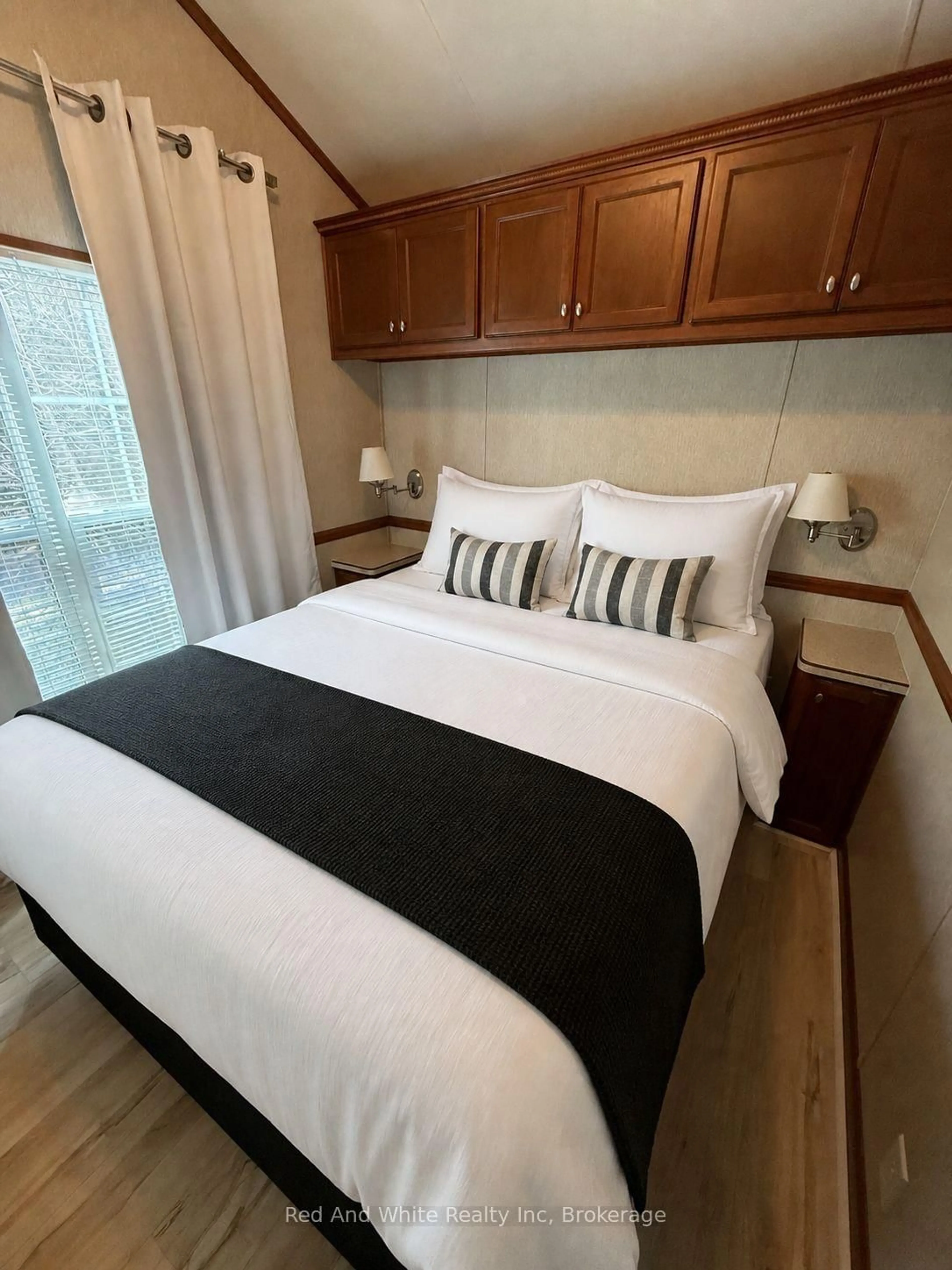 Bedroom with bed, wood/laminate floor for 103 Madawaska Tr, Wasaga Beach Ontario L9Z 1X7