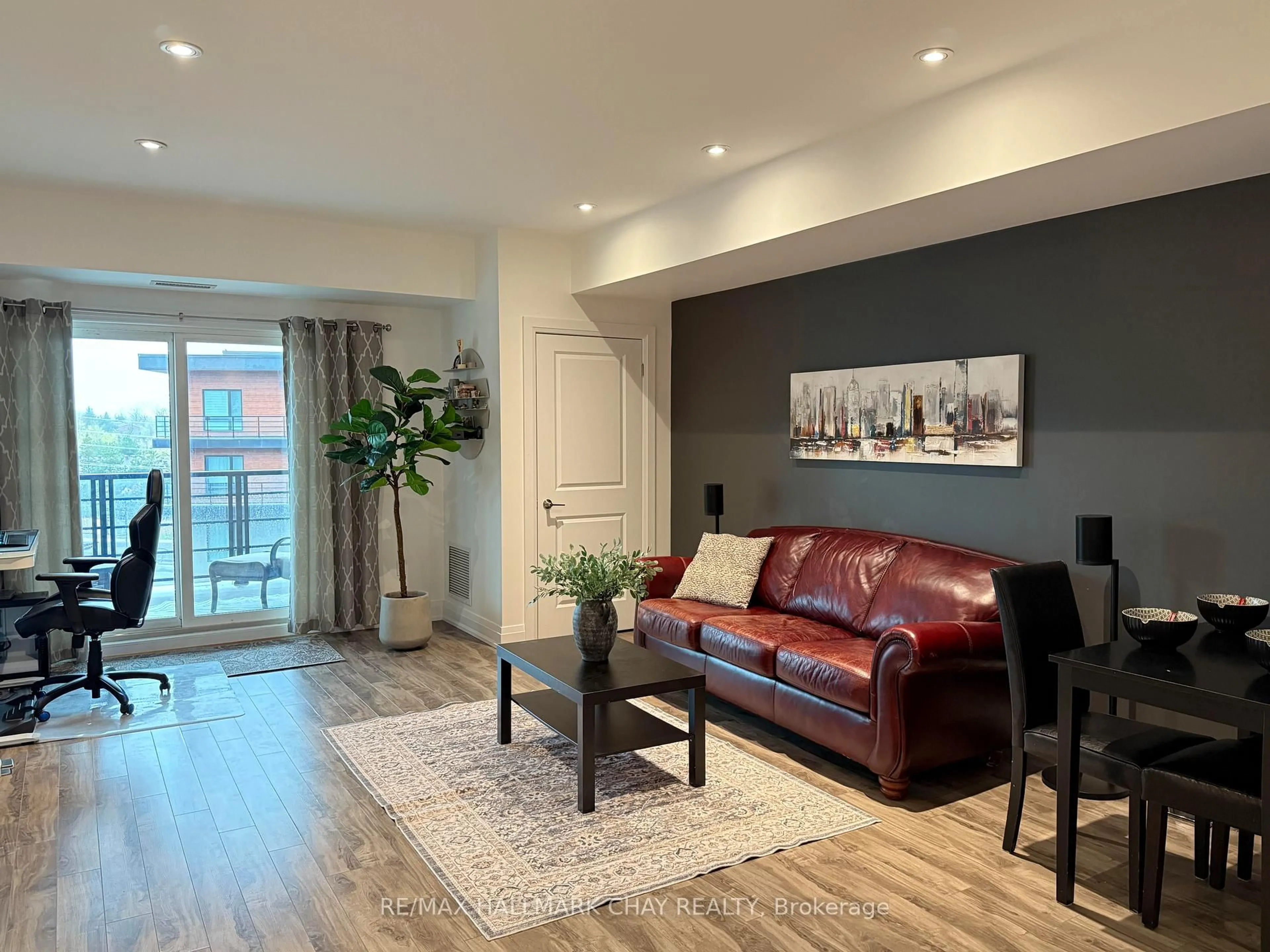 Living room with furniture, wood/laminate floor for 302 Essa Rd #505, Barrie Ontario L9J 0H3