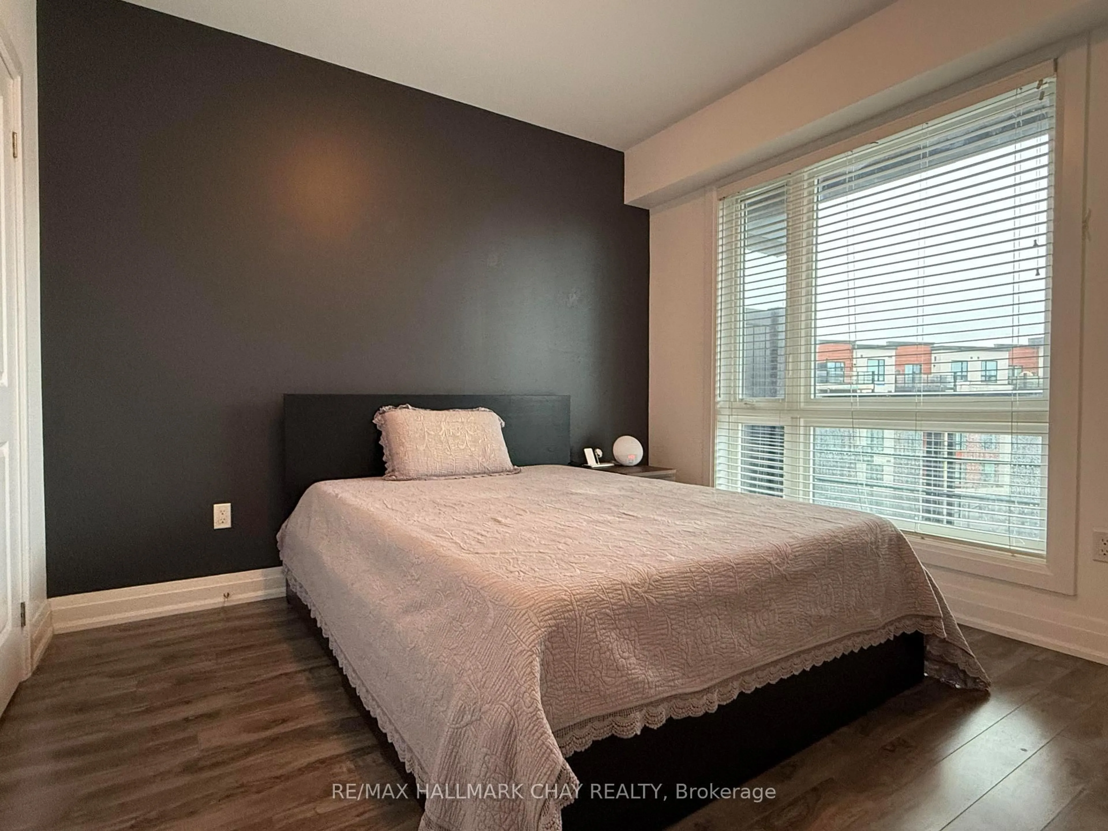 Bedroom with bed, wood/laminate floor for 302 Essa Rd #505, Barrie Ontario L9J 0H3